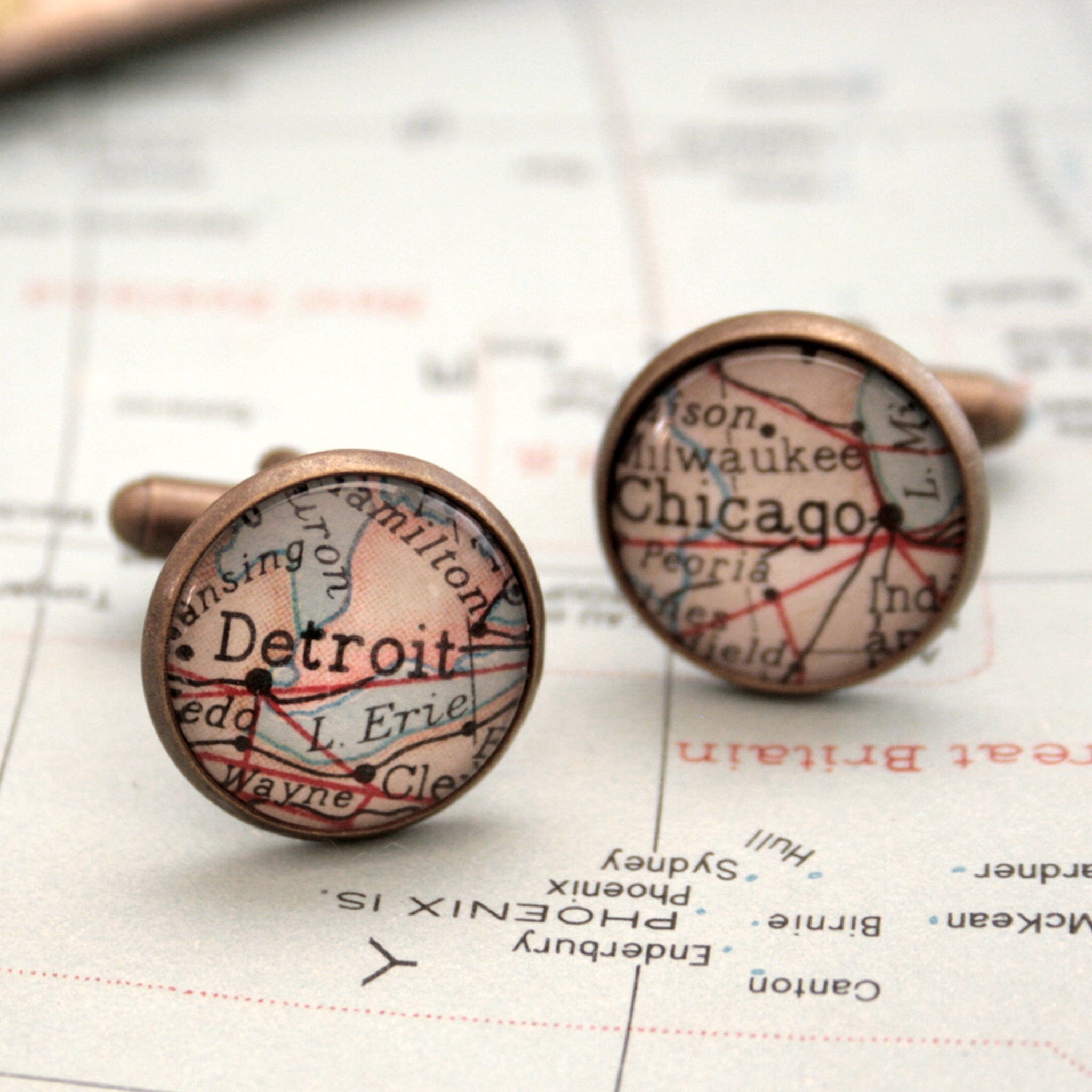 Personalised map cufflinks in antique bronze color featuring maps of Detroit and Chicago