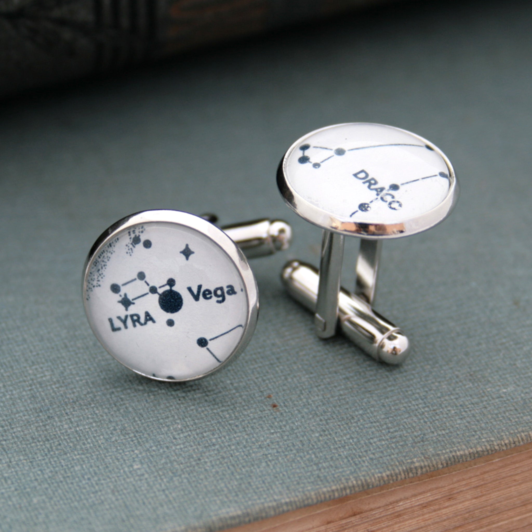 White cufflinks on silver blanks featuring Lyra and Draco star constellations