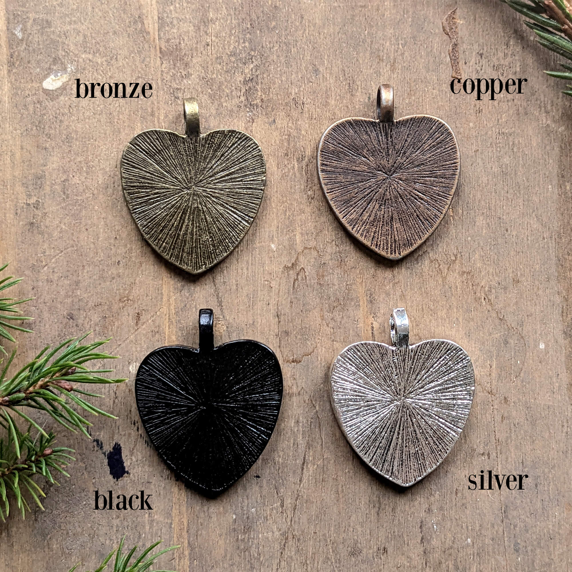 Four metal Christmas tree ornaments in heart shape