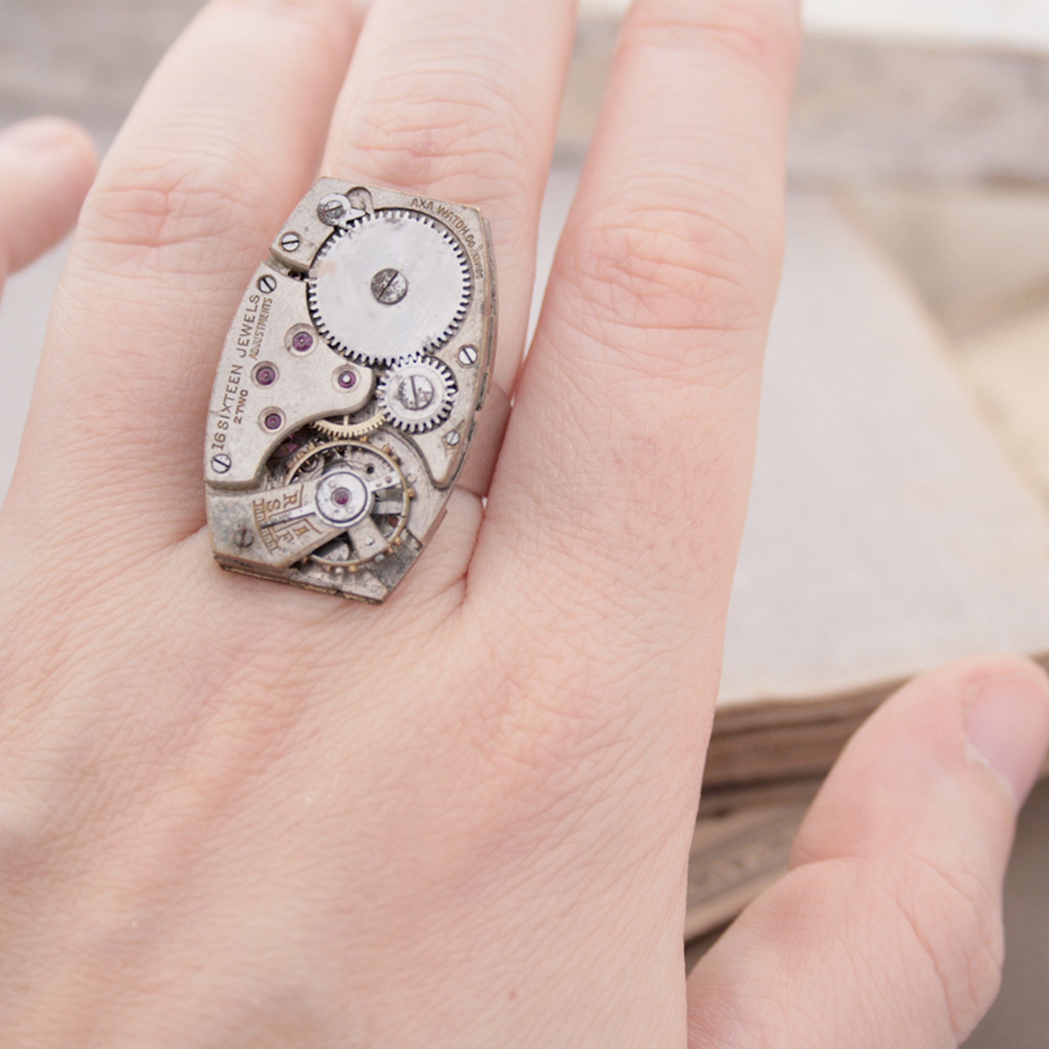 Steampunk Cocktail Ring made of vintage watch movement on hand