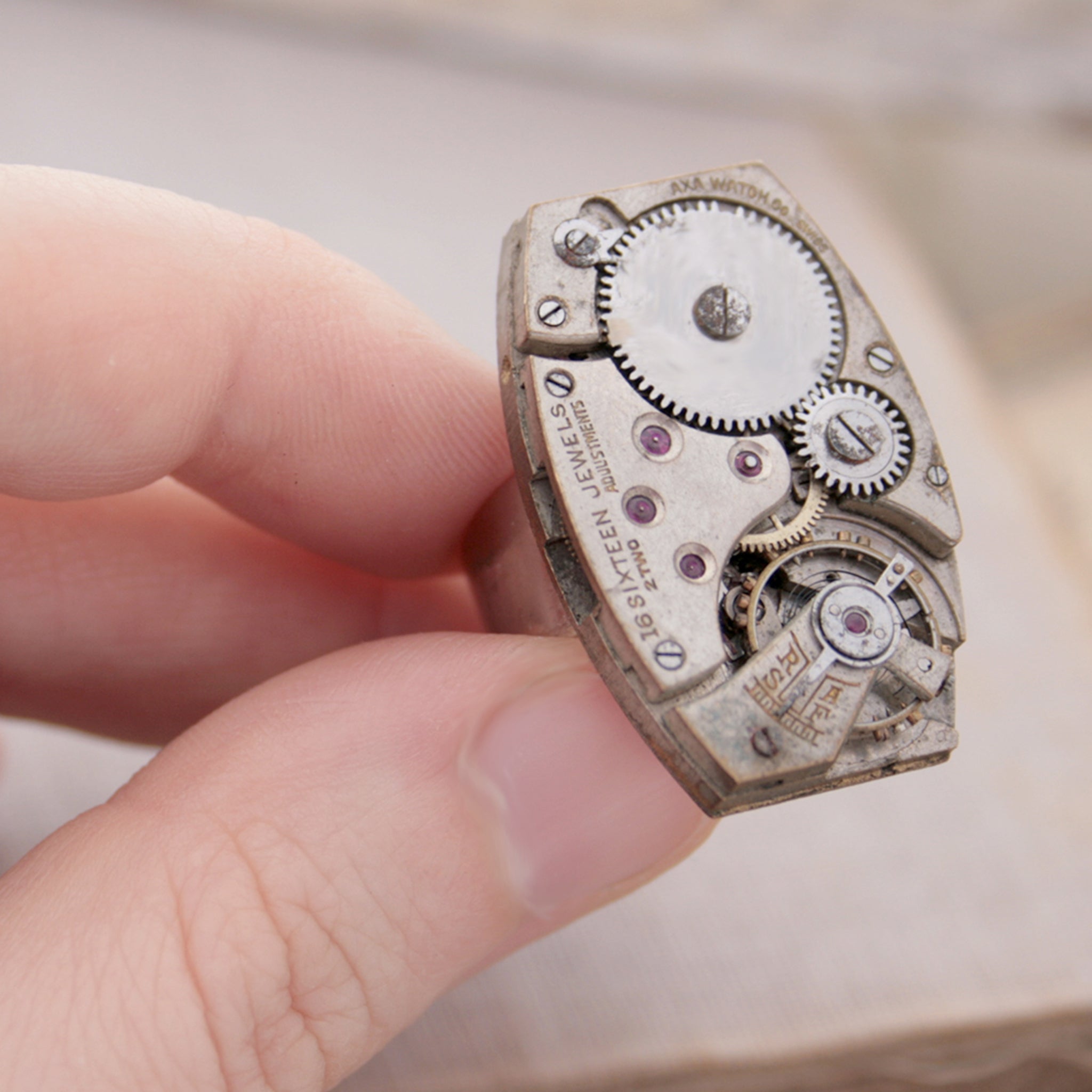 Steampunk Cocktail Ring made of vintage watch movement on hand