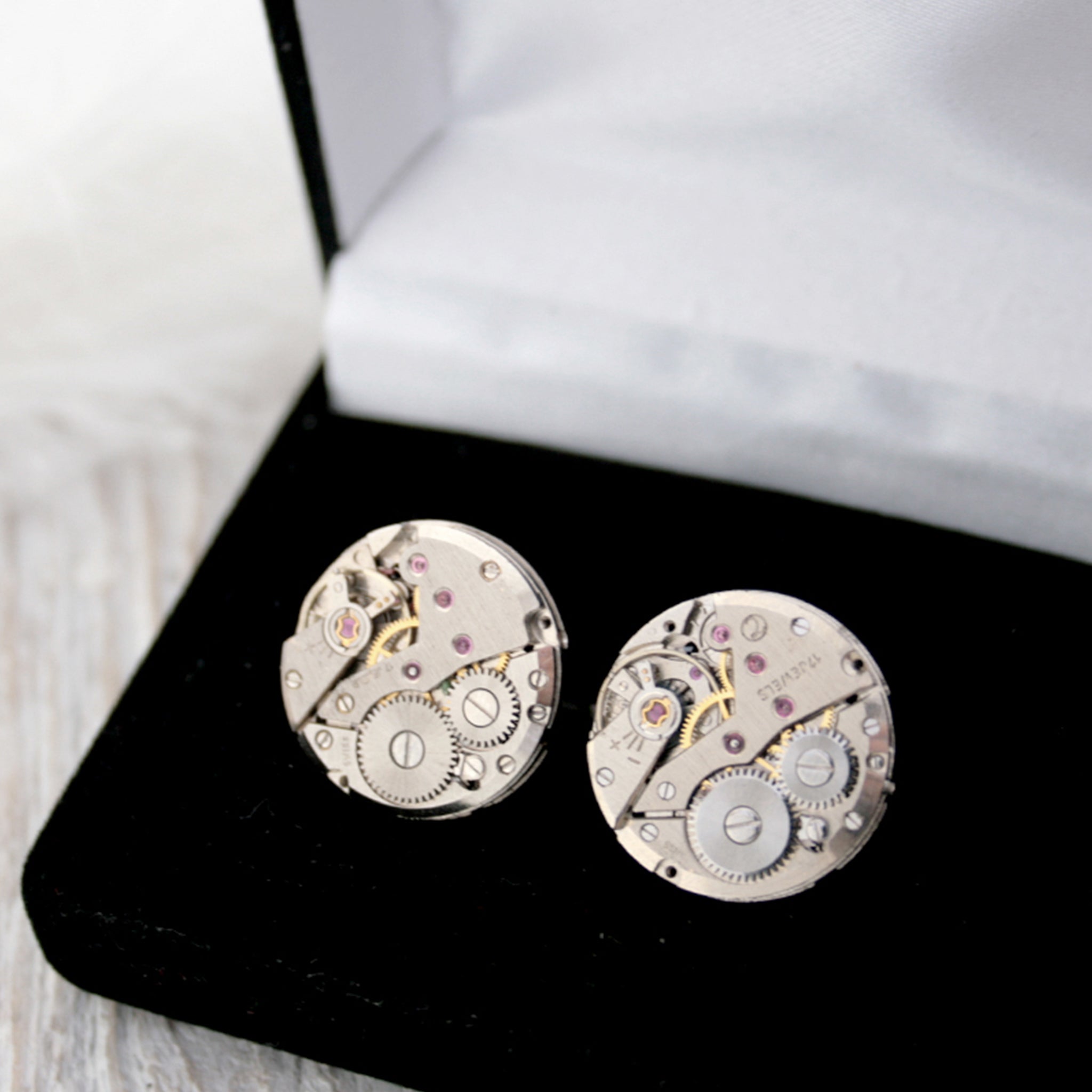 cool cufflinks for watch lovers featuring antique watch movements in black velour box