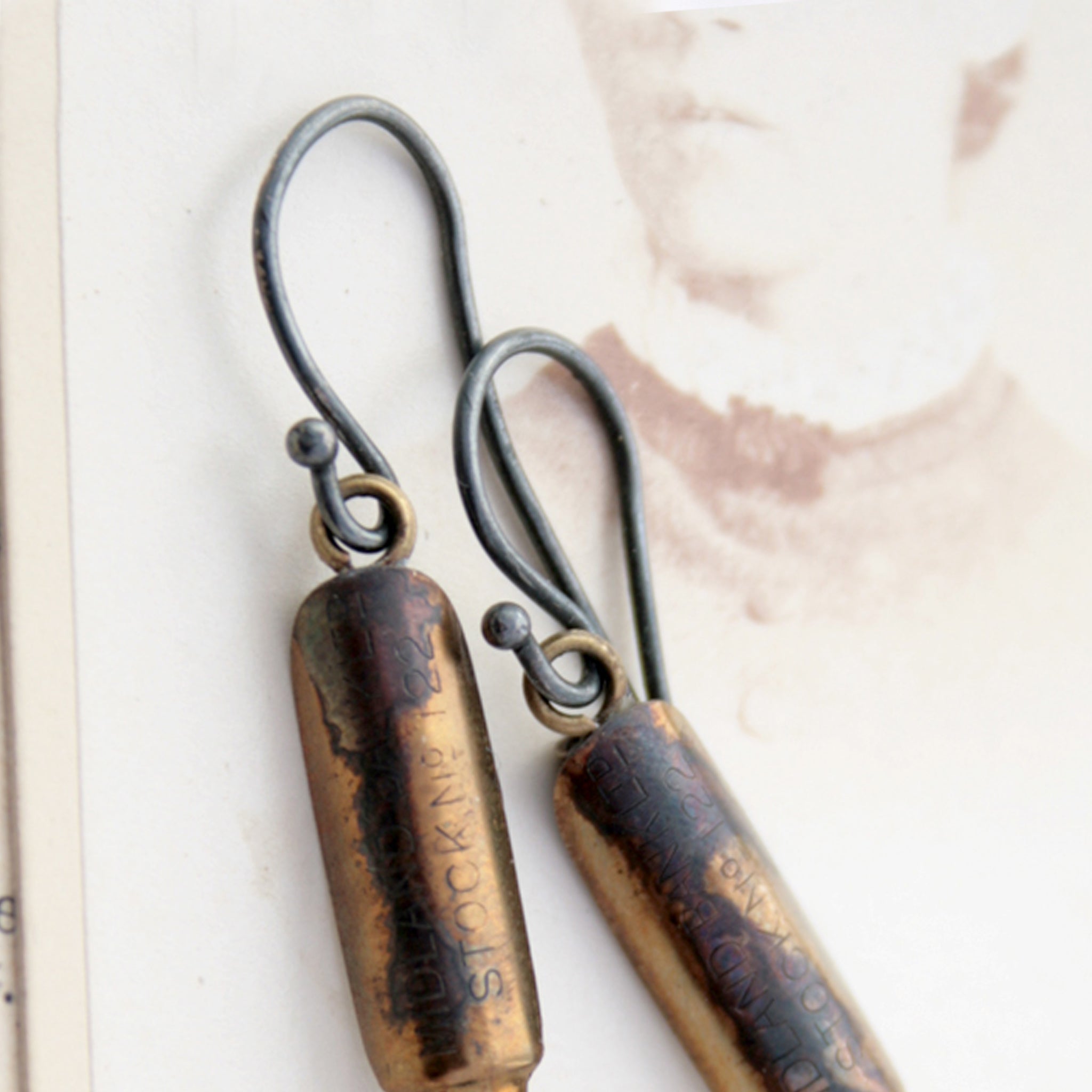french hooks on real pen nibs lying on an old letter