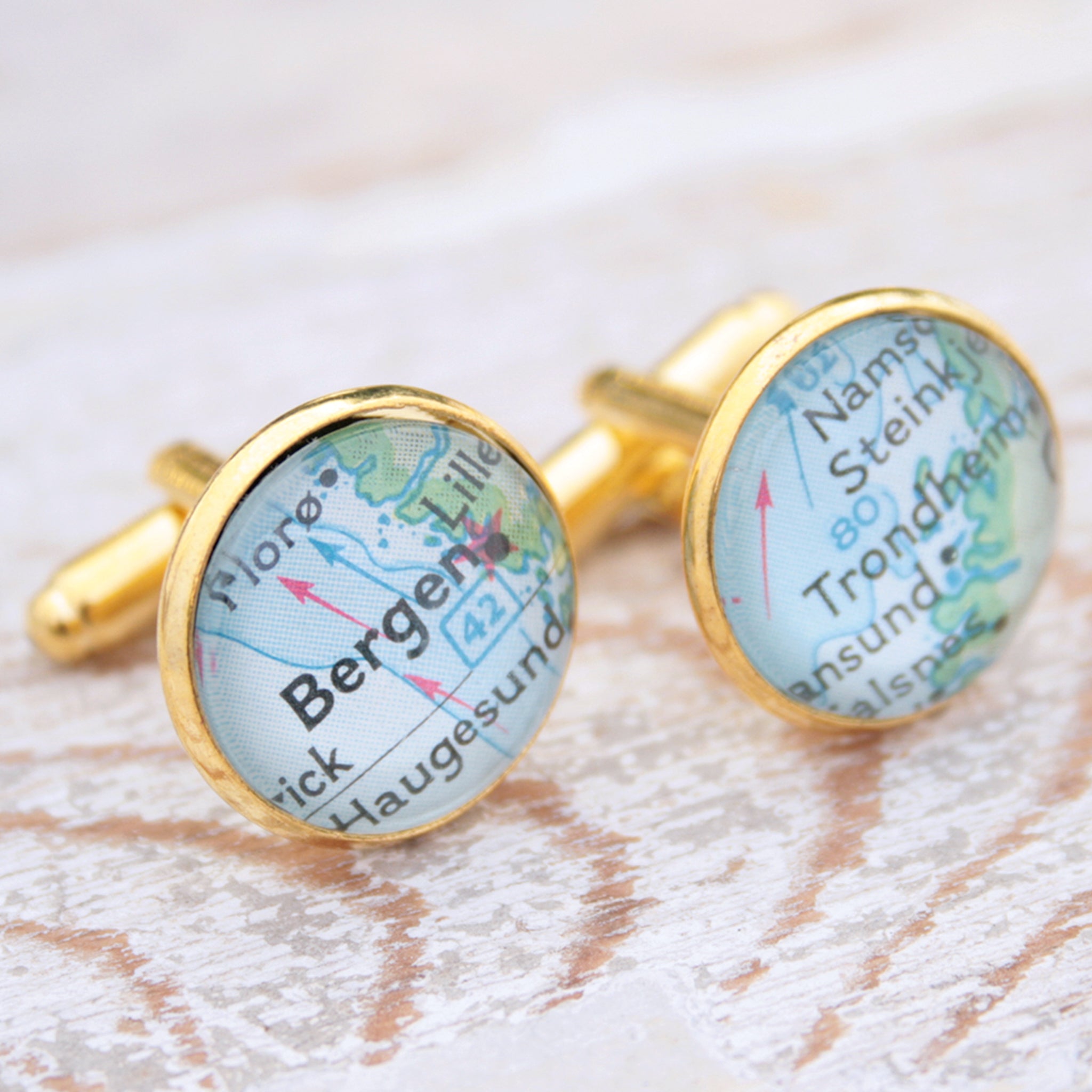 Personalised map cufflinks in gold color featuring maps of Bergen and Trondheim