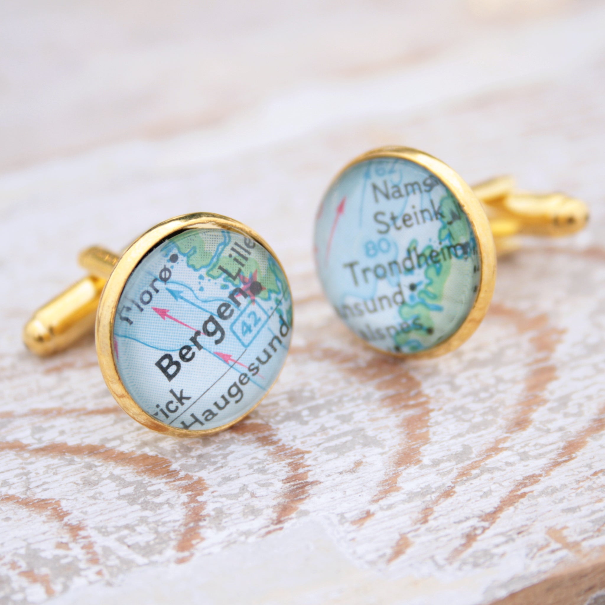 Personalised map cufflinks in gold color featuring maps of Bergen and Trondheim