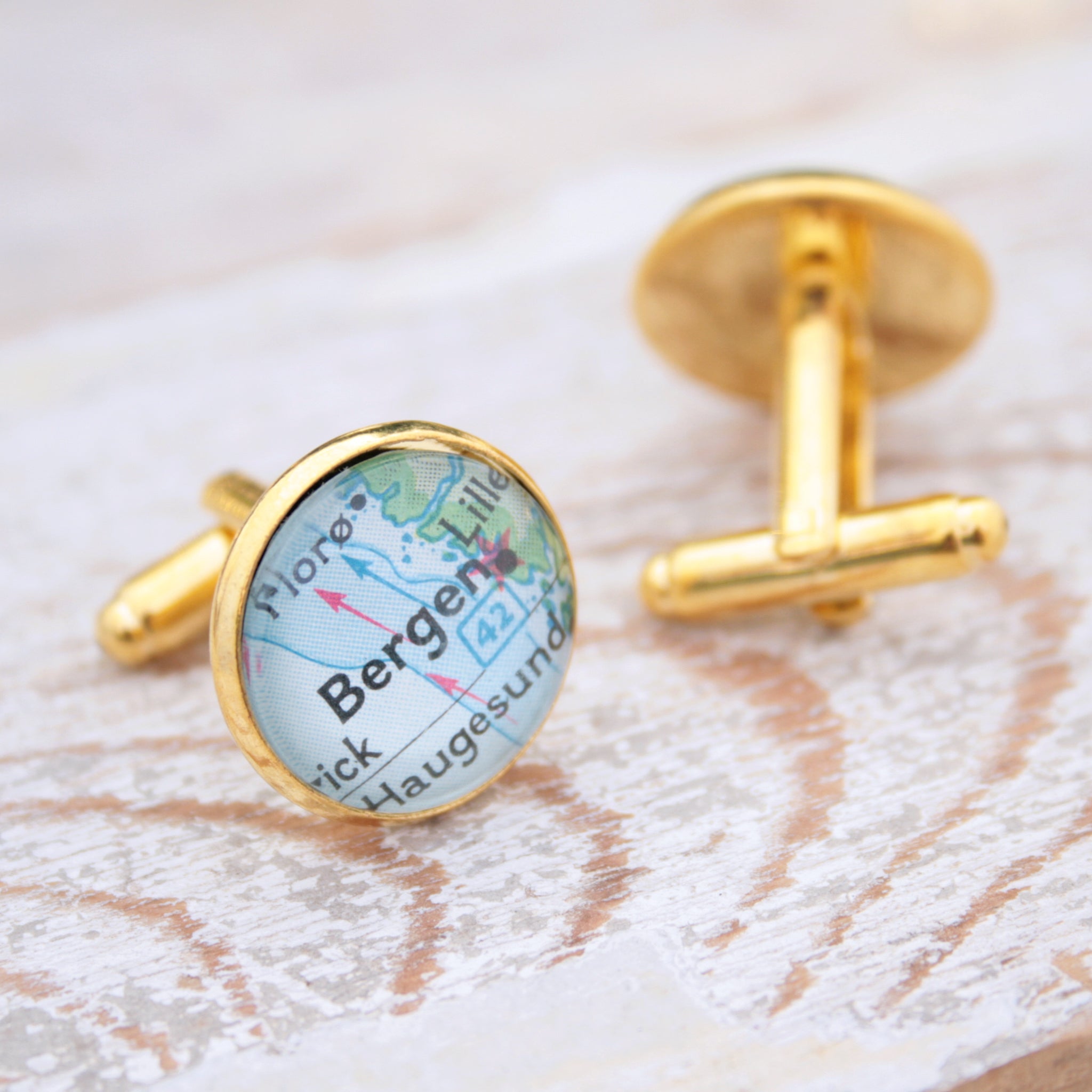 Personalised map cufflinks in gold color featuring maps of Bergen and Trondheim
