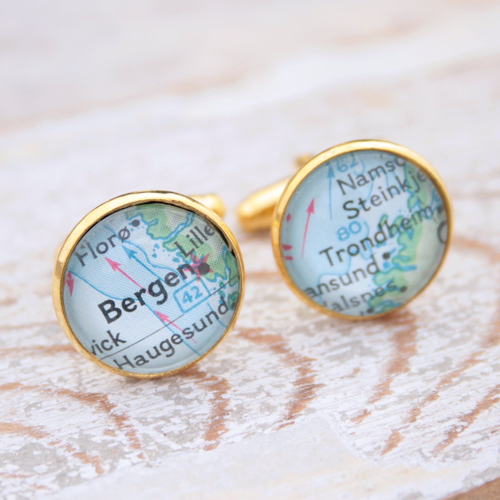 Personalised map cufflinks in gold color featuring maps of Bergen and Trondheim