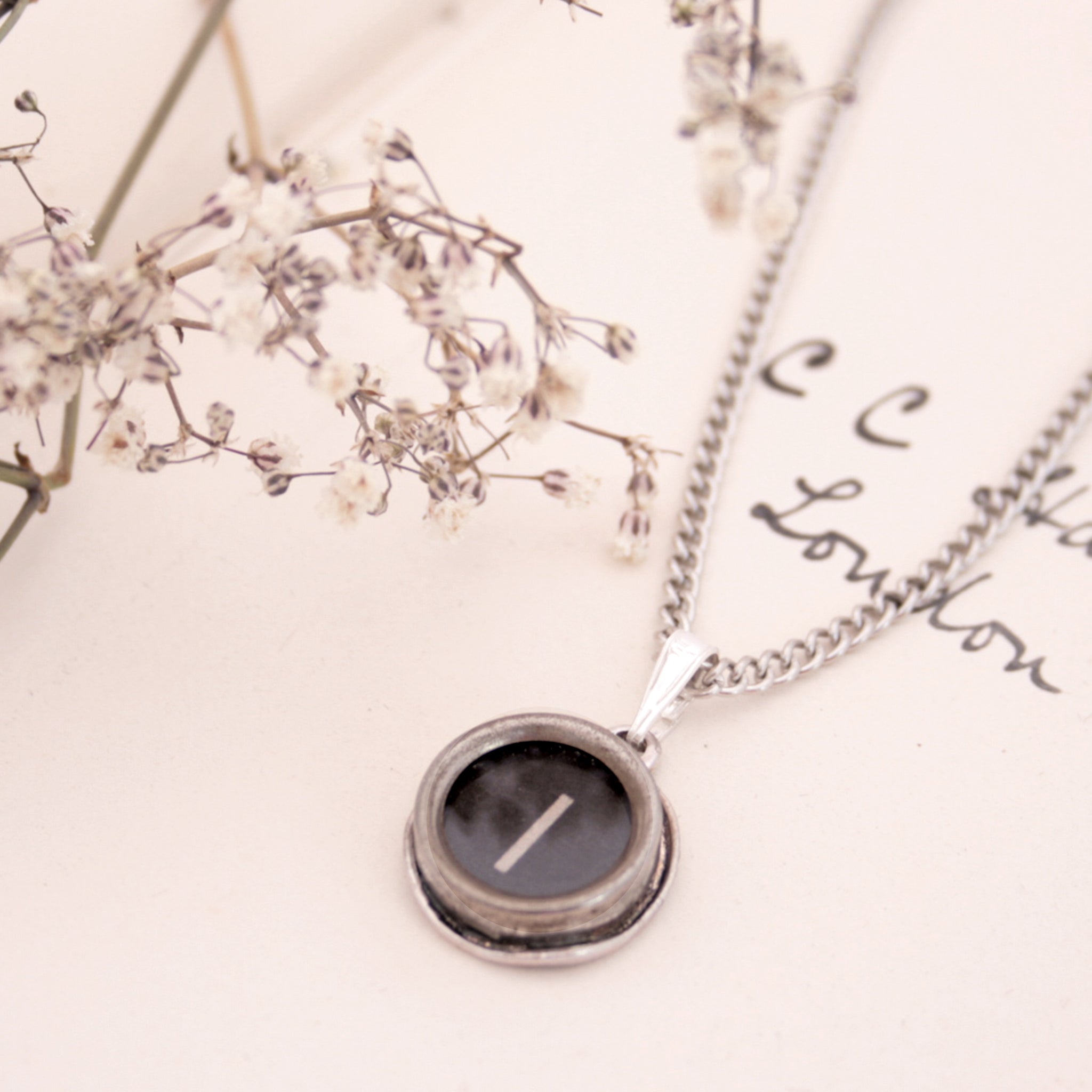 I initial necklace made of authentic vintage black typewriter key