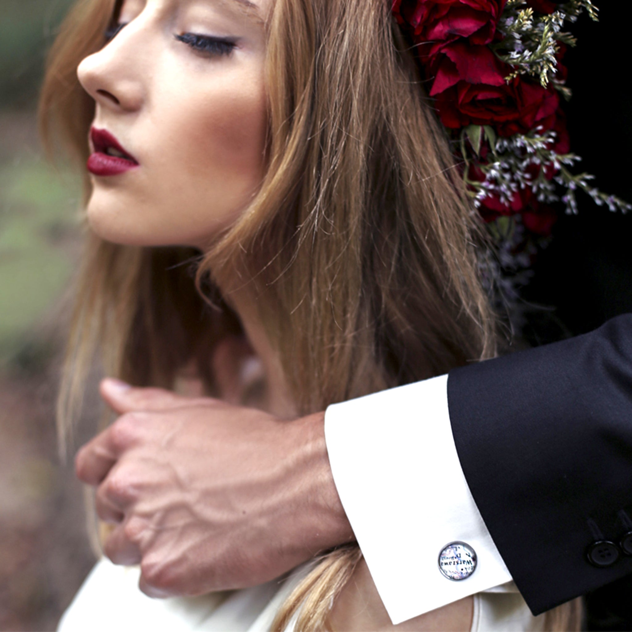 Groom holding hand on bride's shoulder