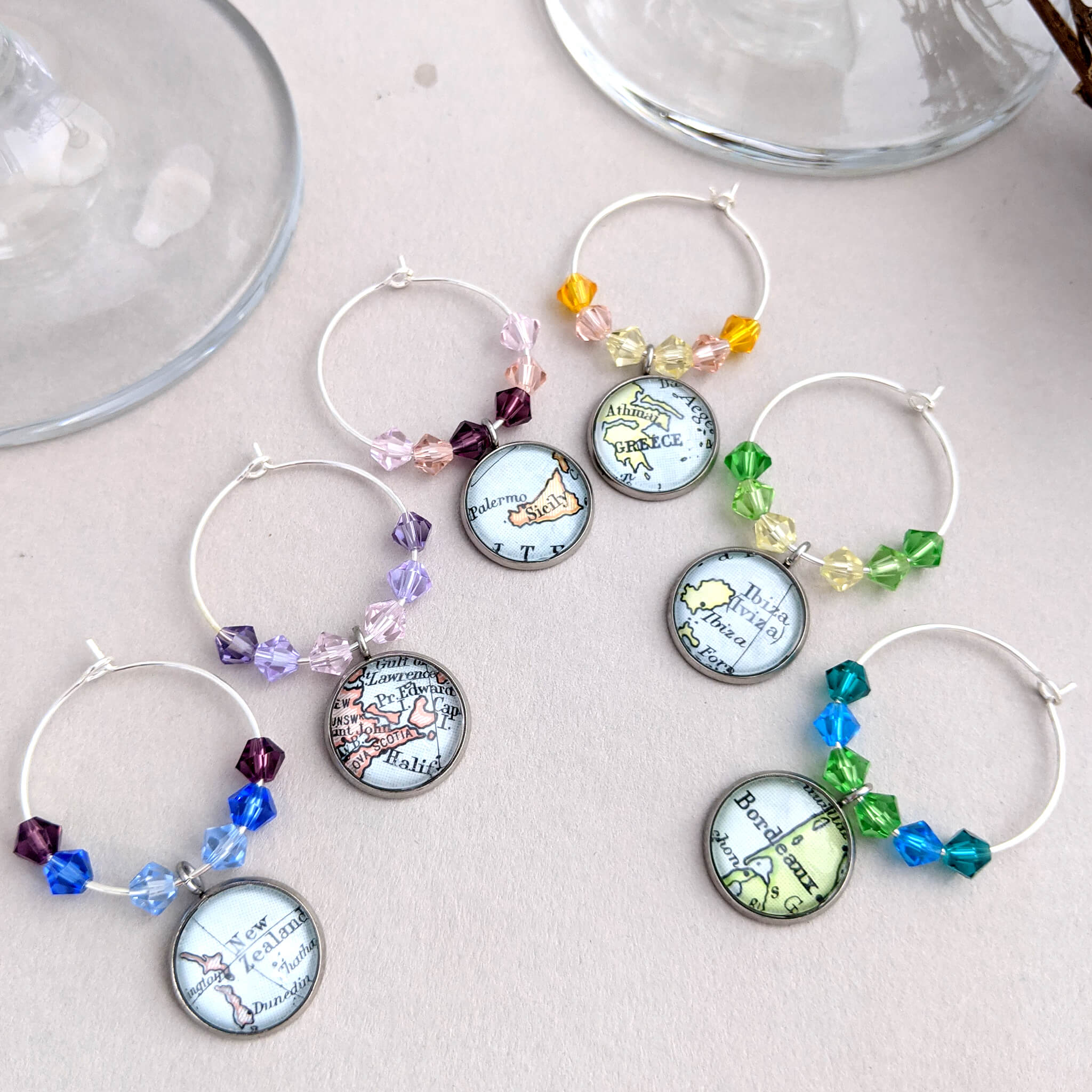 set of 6 wine glass charms personalised with map locations