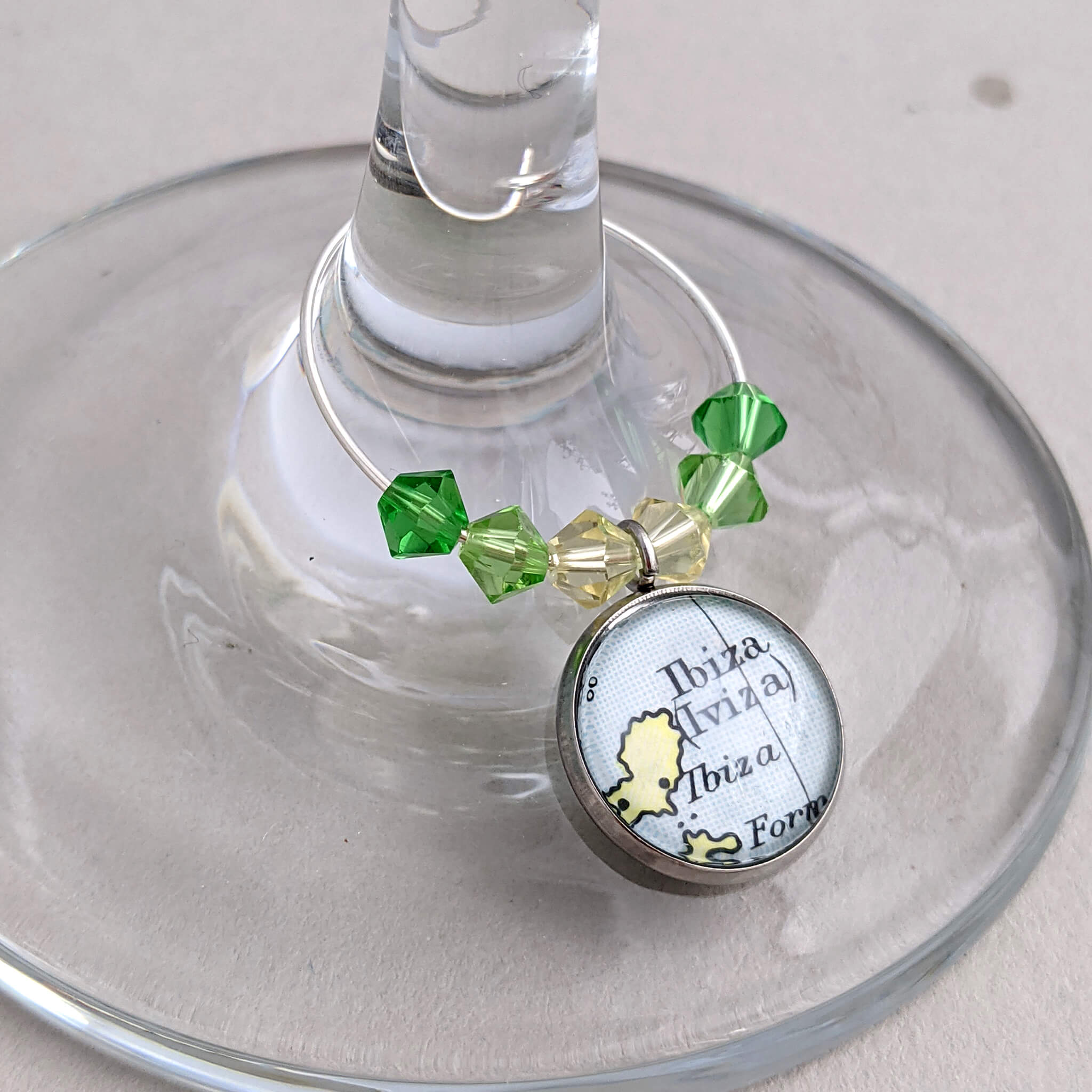 wine glass charm in green tone personalised with map of Ibiza