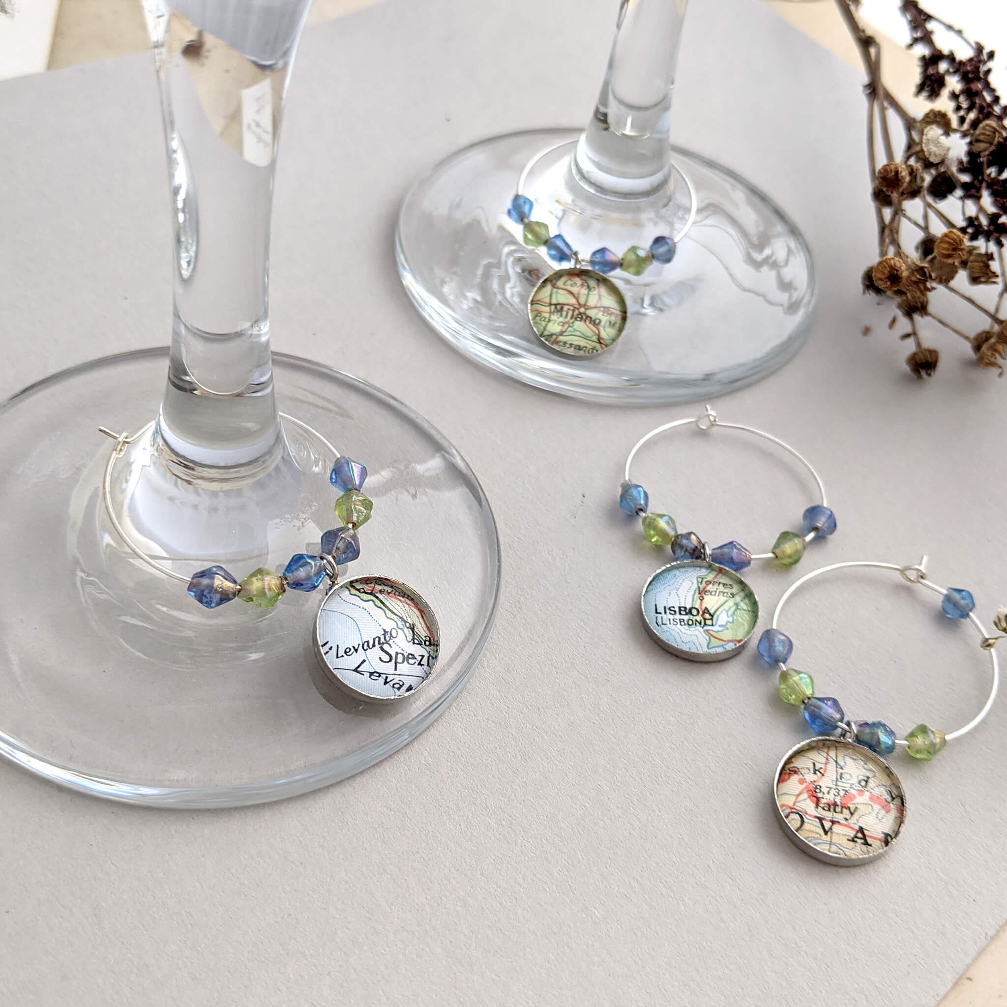 wine glasses with personalised charms with map locations