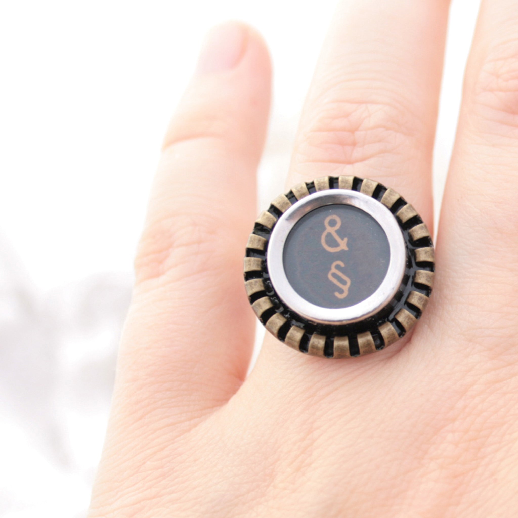 Black Ring featuring Amresand and paragraph signs made of typewriter key worn on hand