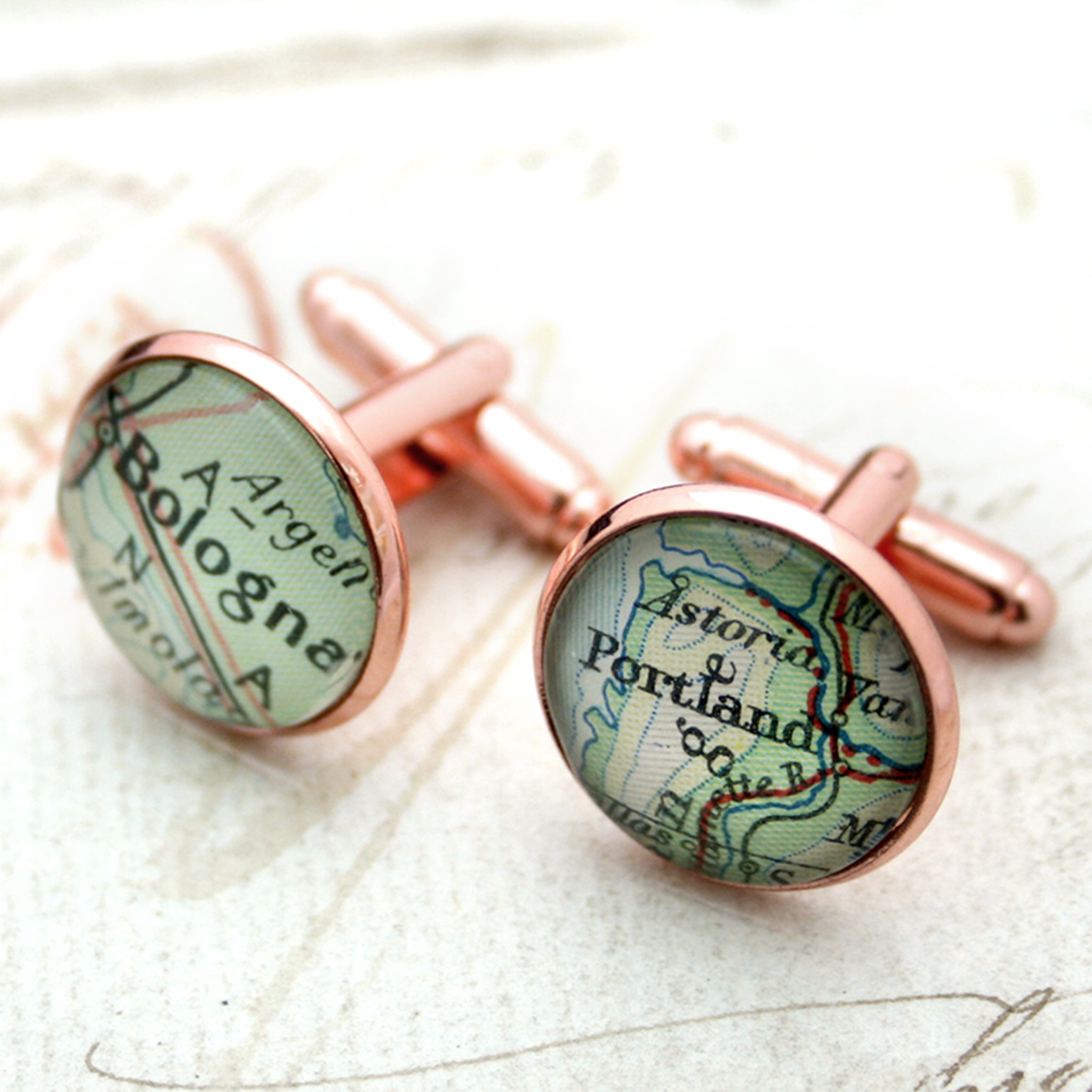 Personalised map cufflinks in rose gold color featuring Bologna and Portland
