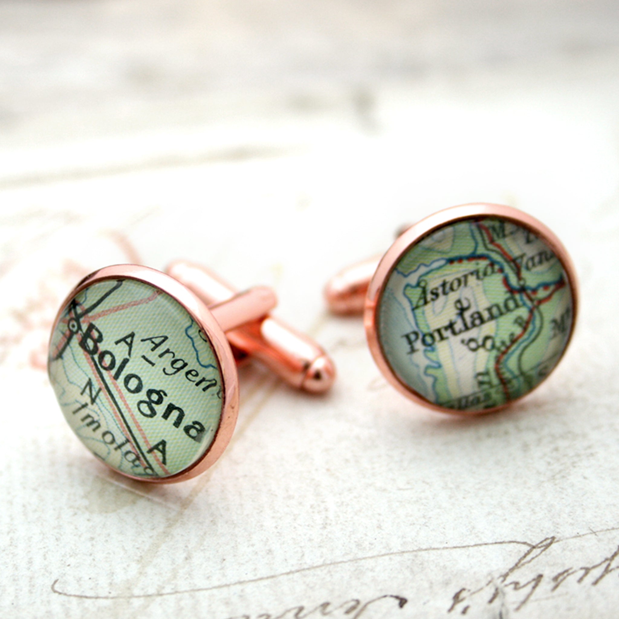 Personalised map cufflinks in rose gold color featuring Bologna and Portland