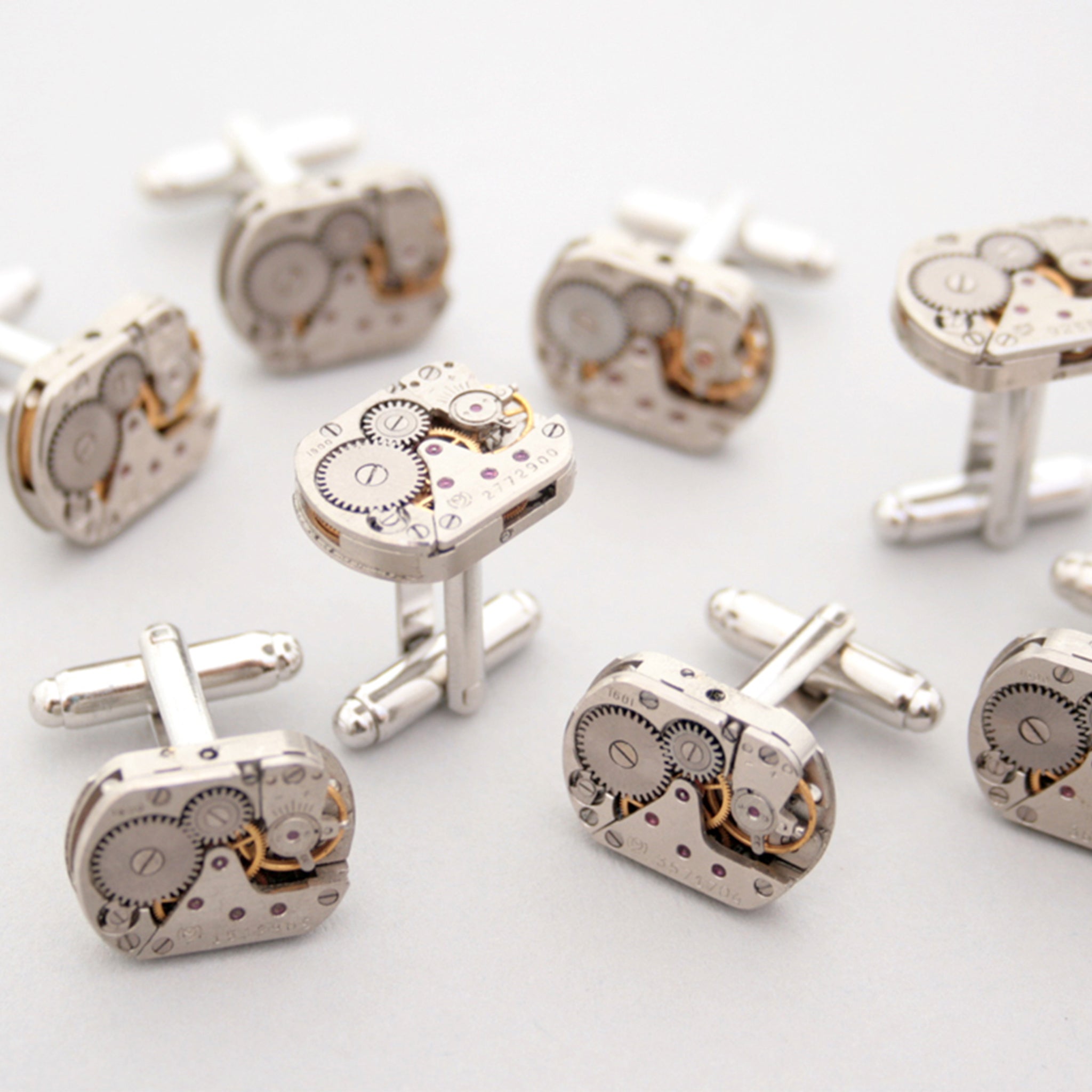Many sets of Steampunk Cufflinks for Men featuring antique watch movements