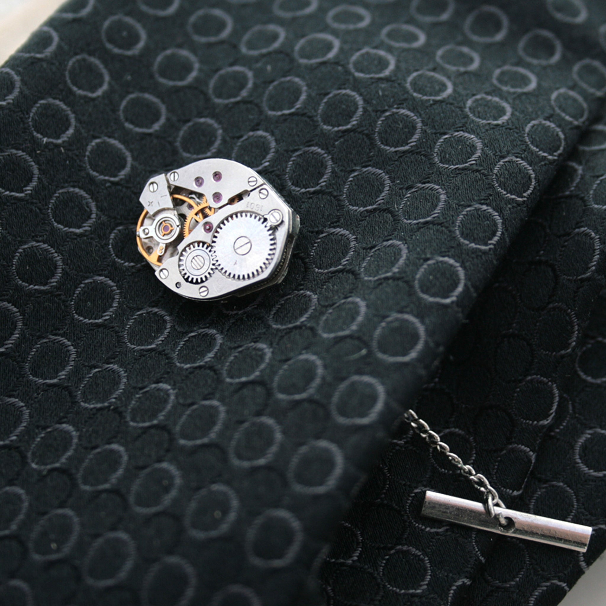 Steam punk tie tack with chain made of real watch on a tie