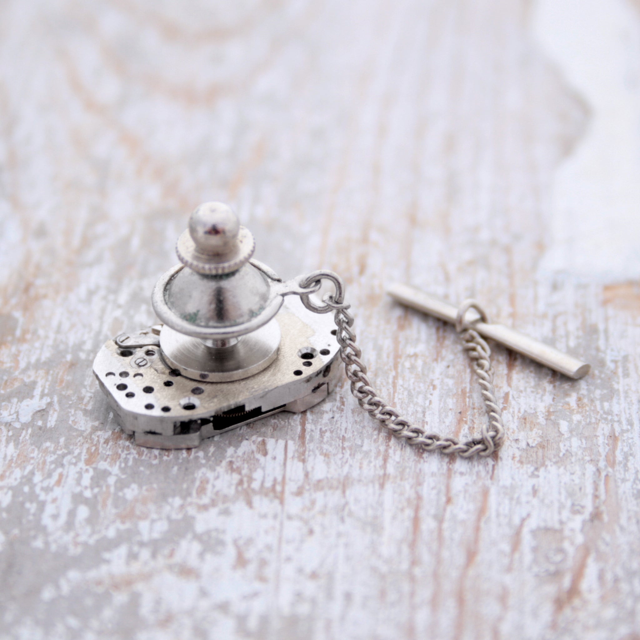Tie Tack with chain seen from the back side
