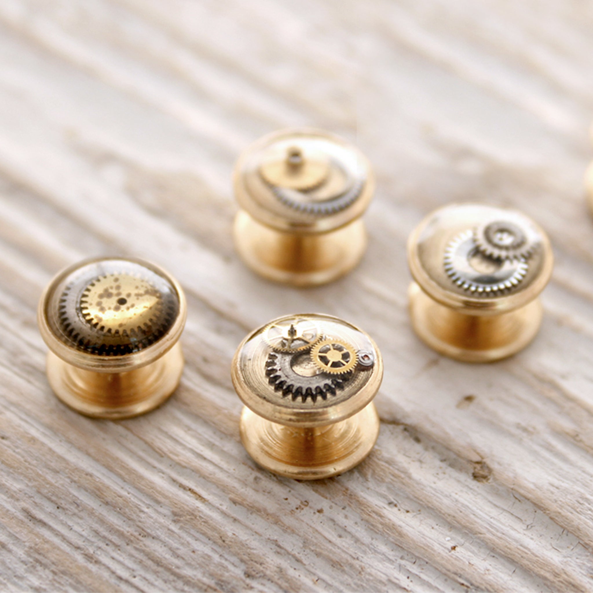 Little tuxedo studs made of raw brass, watch parts and resin