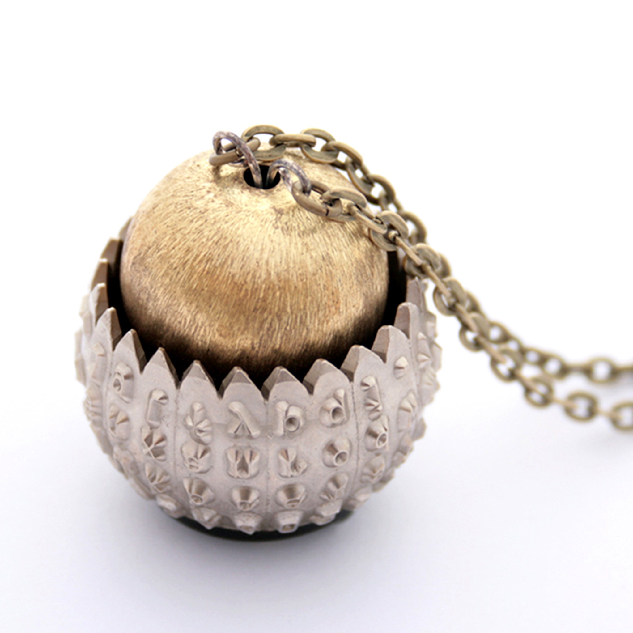 IBM Selectric typewriter font ball with large gold tone bead turned into eye catching necklace