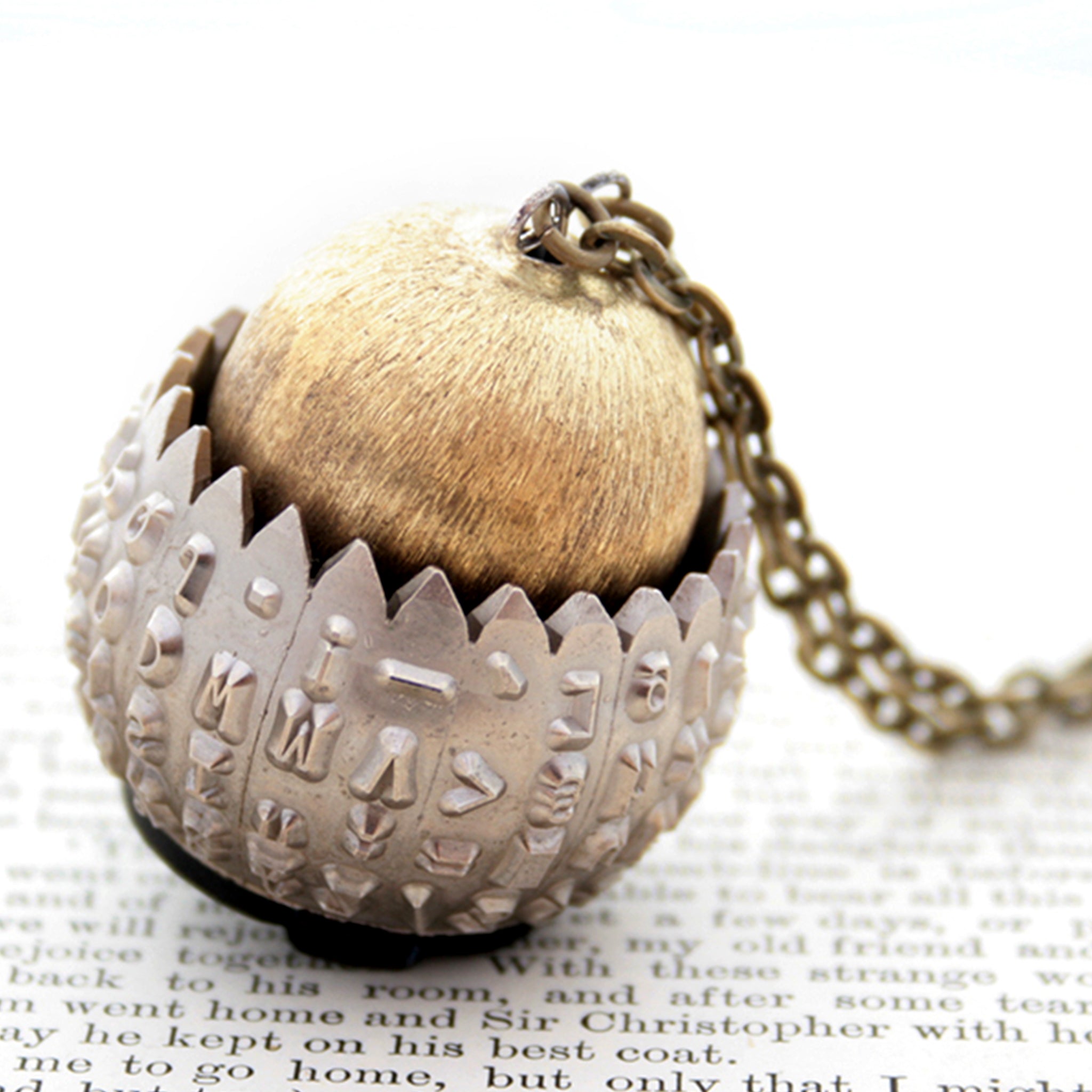 IBM Selectric typewriter font ball with large gold tone bead turned into eye catching necklace