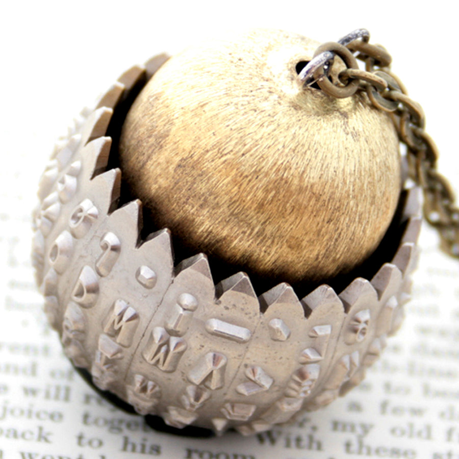 IBM Selectric typewriter font ball with large gold tone bead turned into eye catching necklace