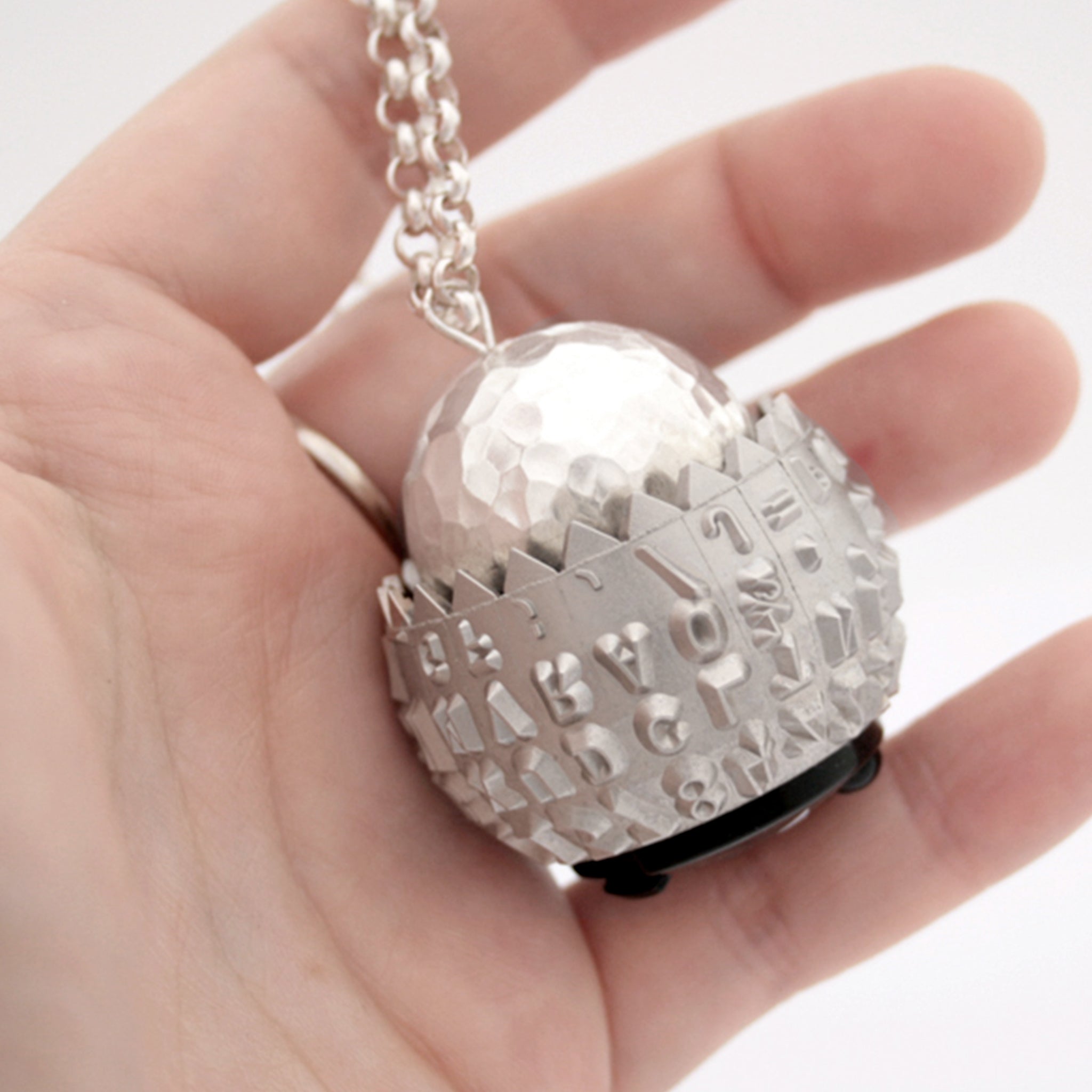 IBM Selectric typeball with sterling silver bead turned into quirky necklace