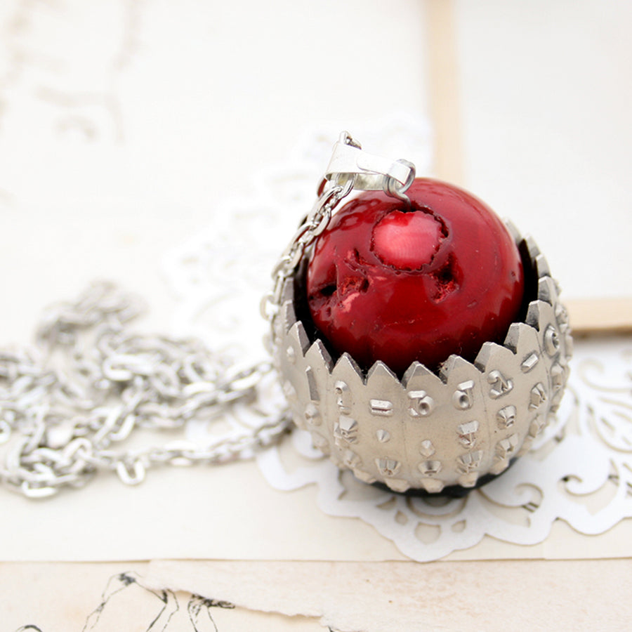 IBM Selectric typewriter font ball with large coral bead turned into eye catching necklace