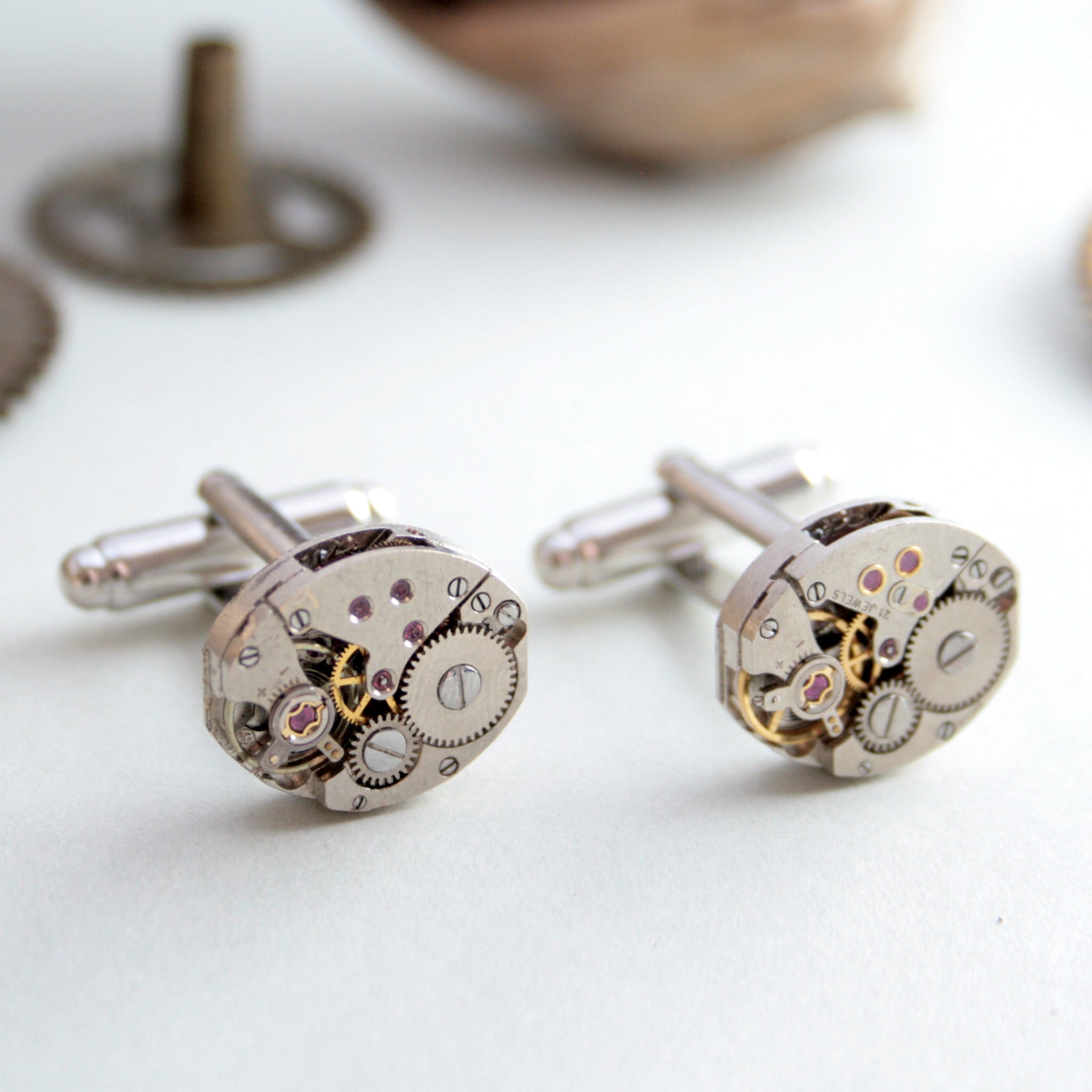 steampunk womens cufflinks featuring antique watch movements