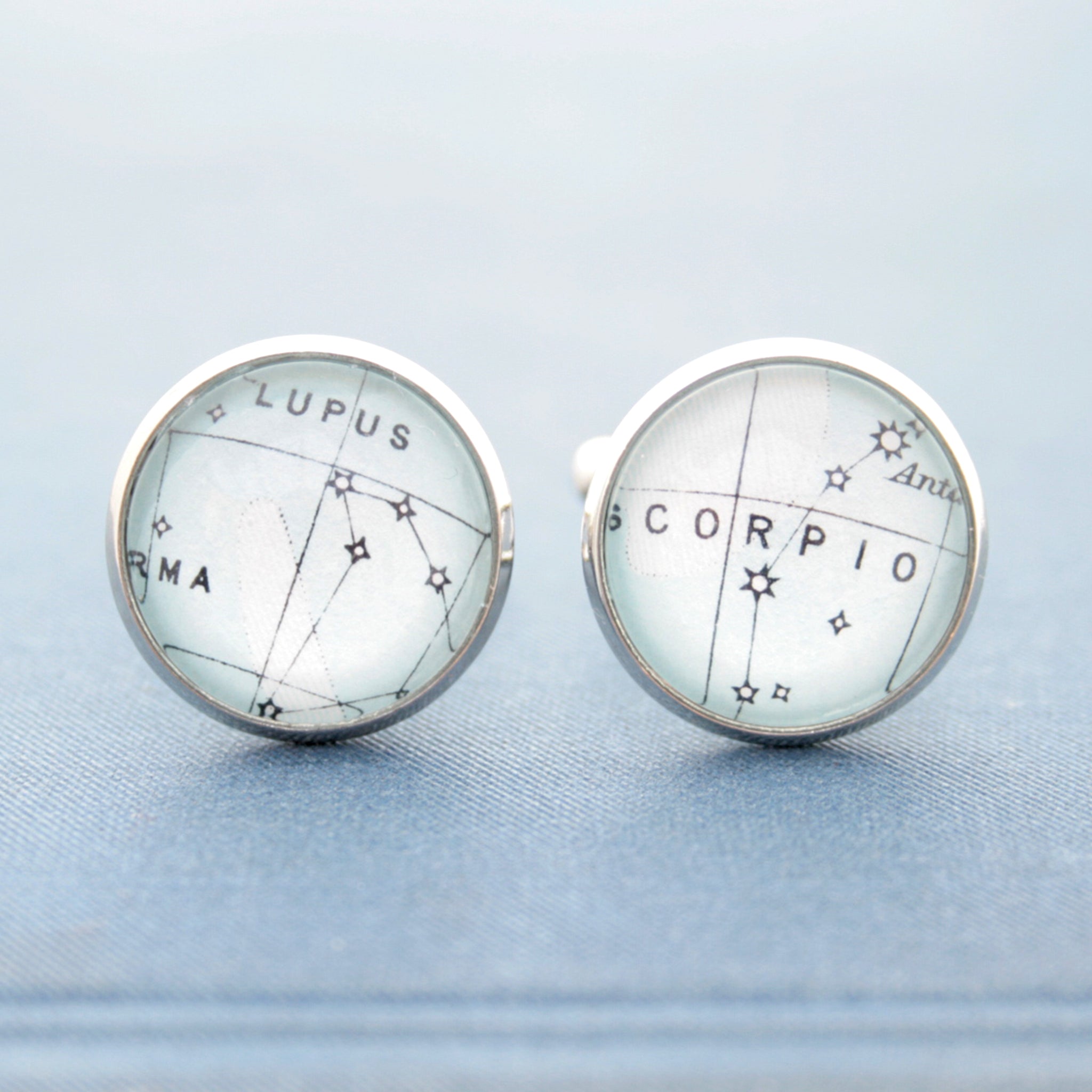 Blue cufflinks on silver blanks featuring star constellations