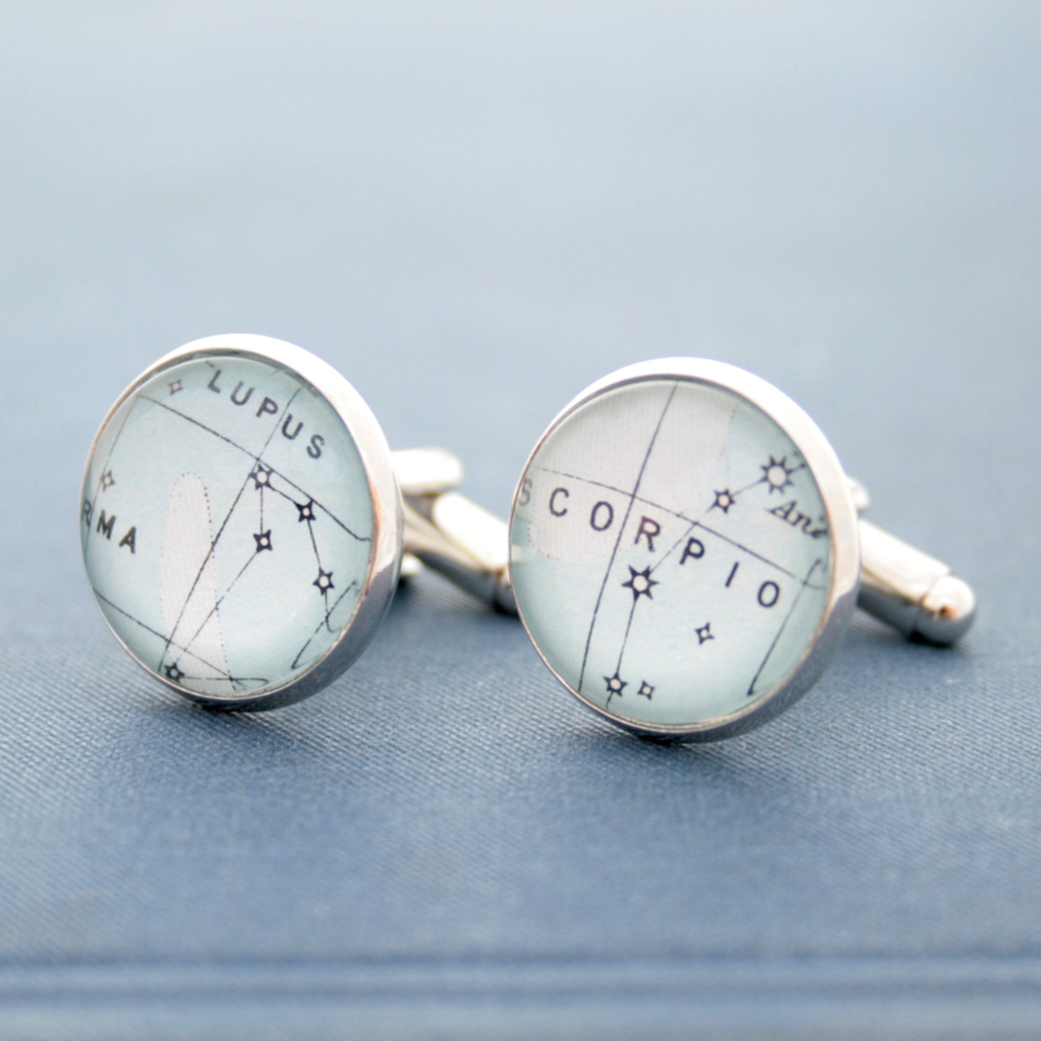 Blue cufflinks on silver blanks featuring star constellations