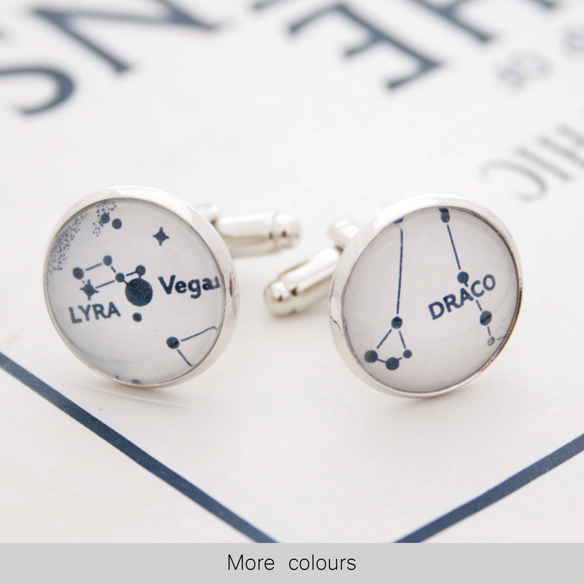 White cufflinks on silver blanks featuring Lyra and Draco star constellations