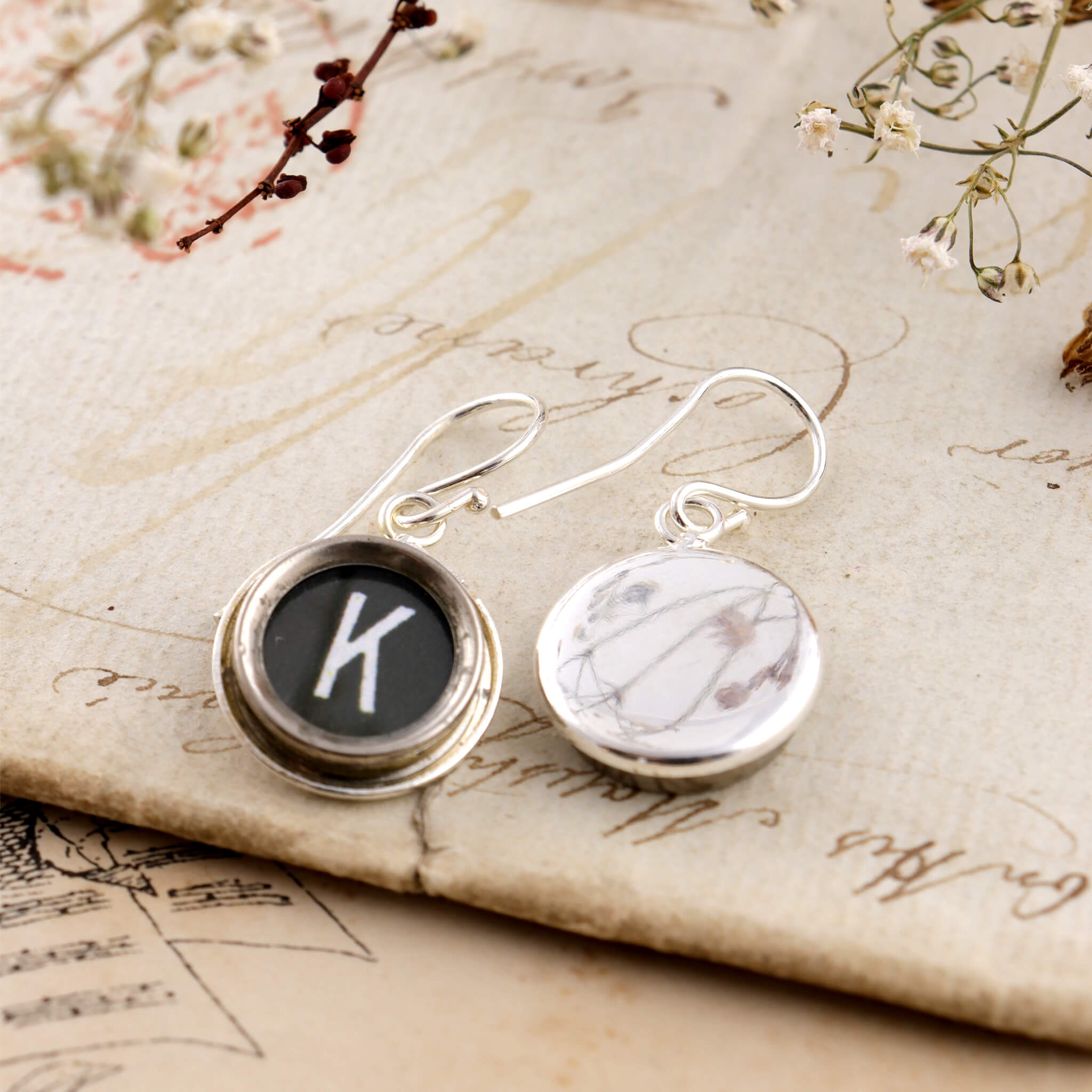 Black initial earrings K made of old typewriter keys one is turned