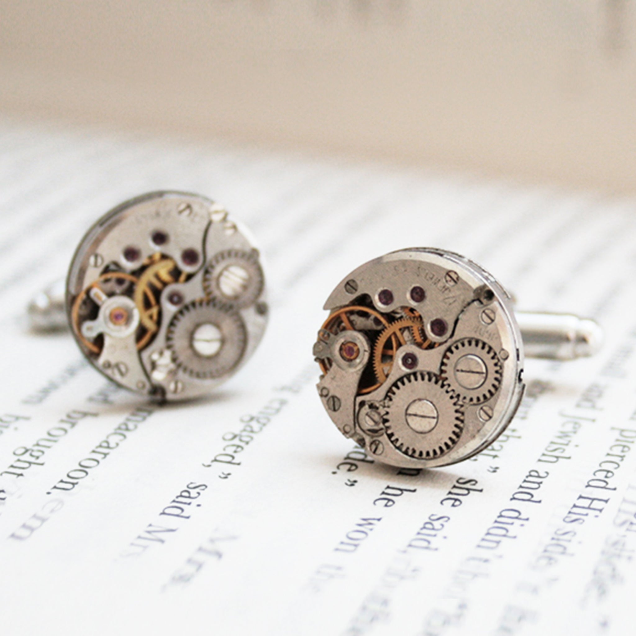 Round watch cufflinks in steampunk style featuring antique watch movements