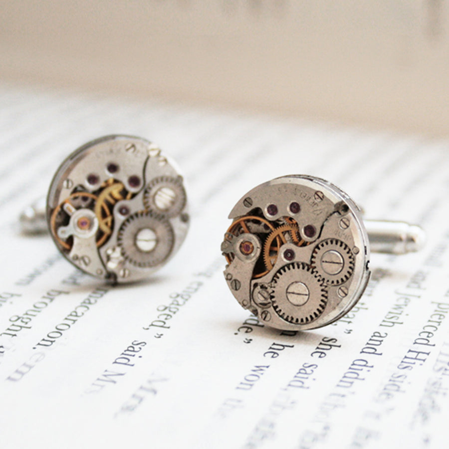 Round watch cufflinks in steampunk style featuring antique watch movements