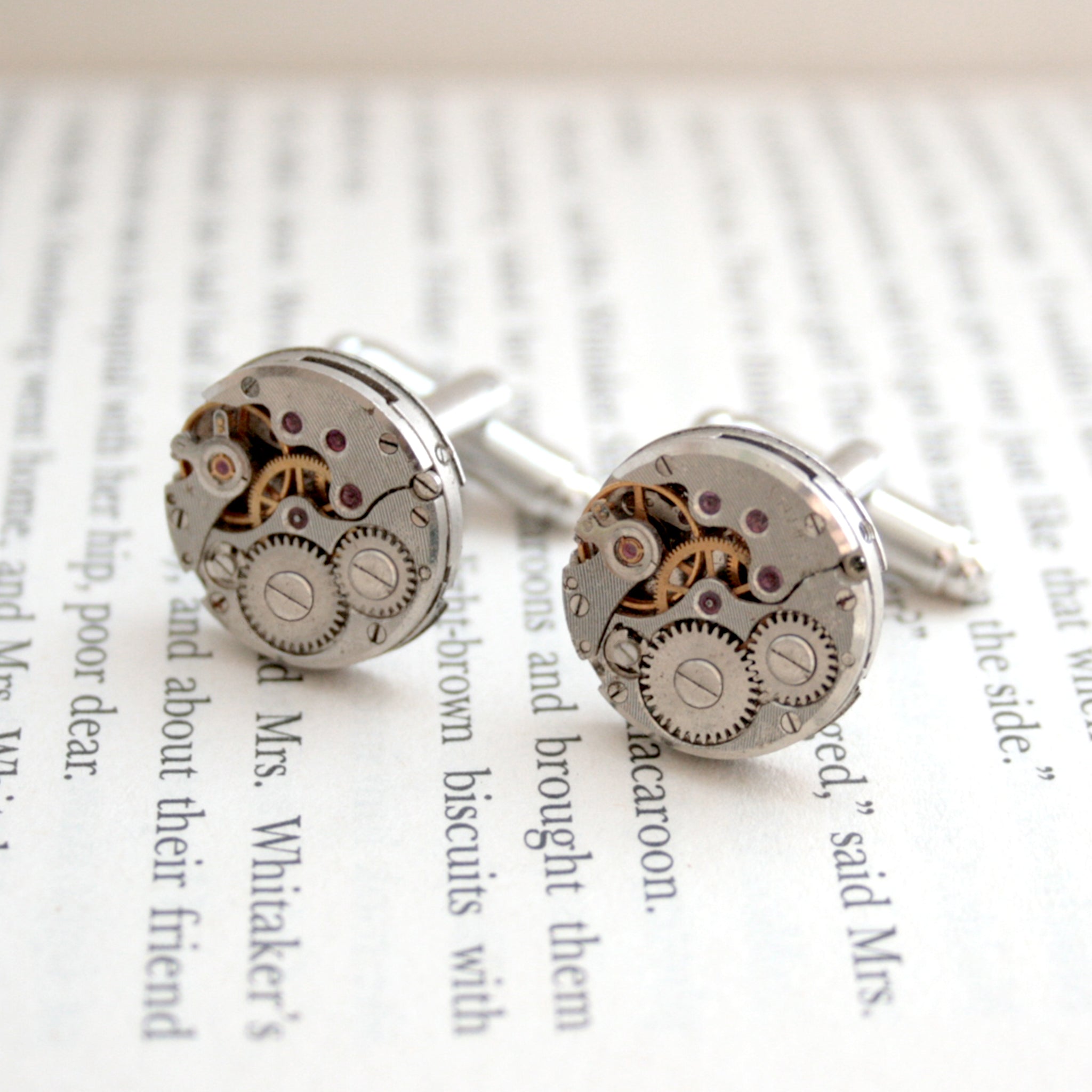 Round watch cufflinks in steampunk style featuring antique watch movements