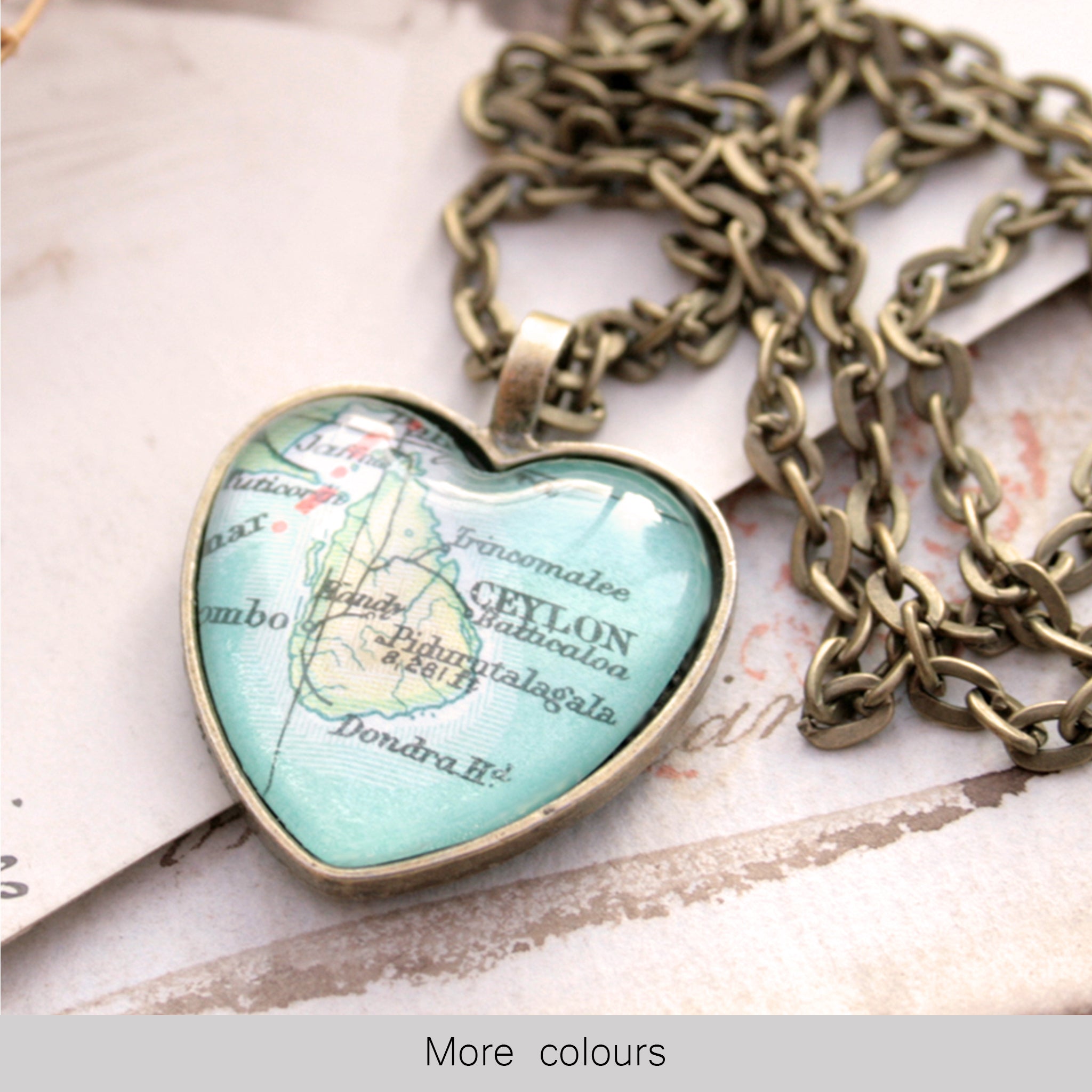 Heart shaped pendant necklace in bronze tone featuring map of Ceylon
