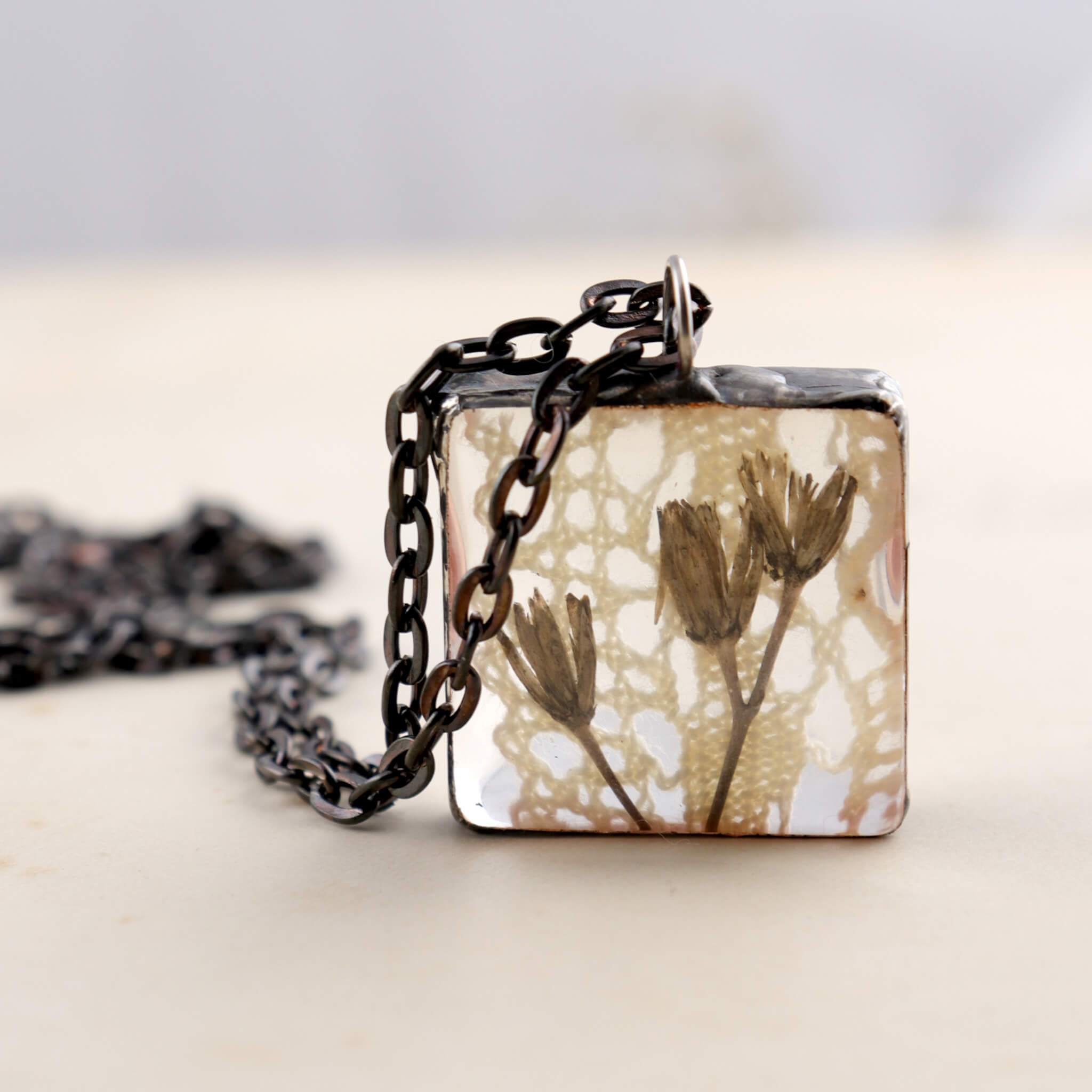 Square soldered necklace with vintage lase and pressed flowers