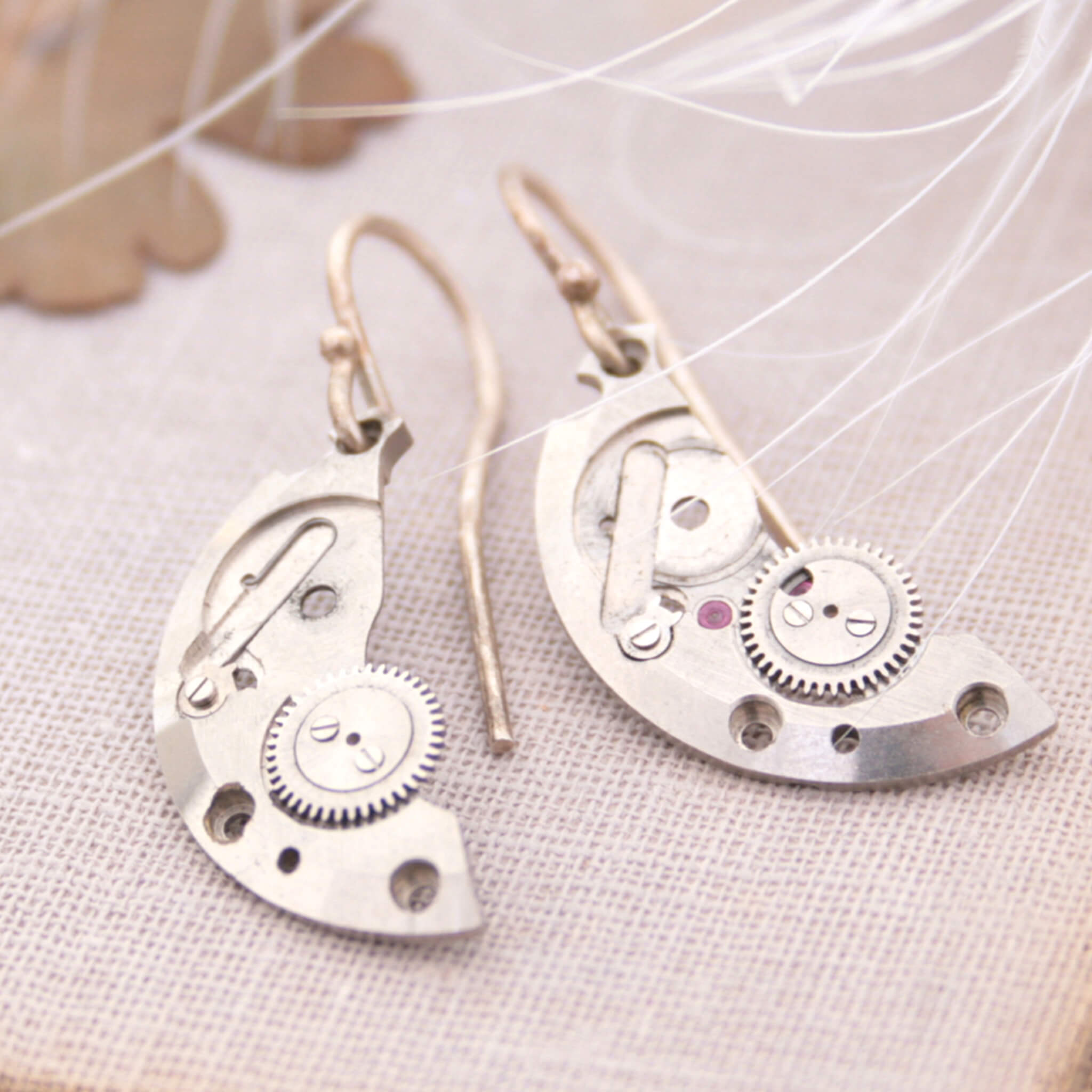 watch parts turned into dangling earrings