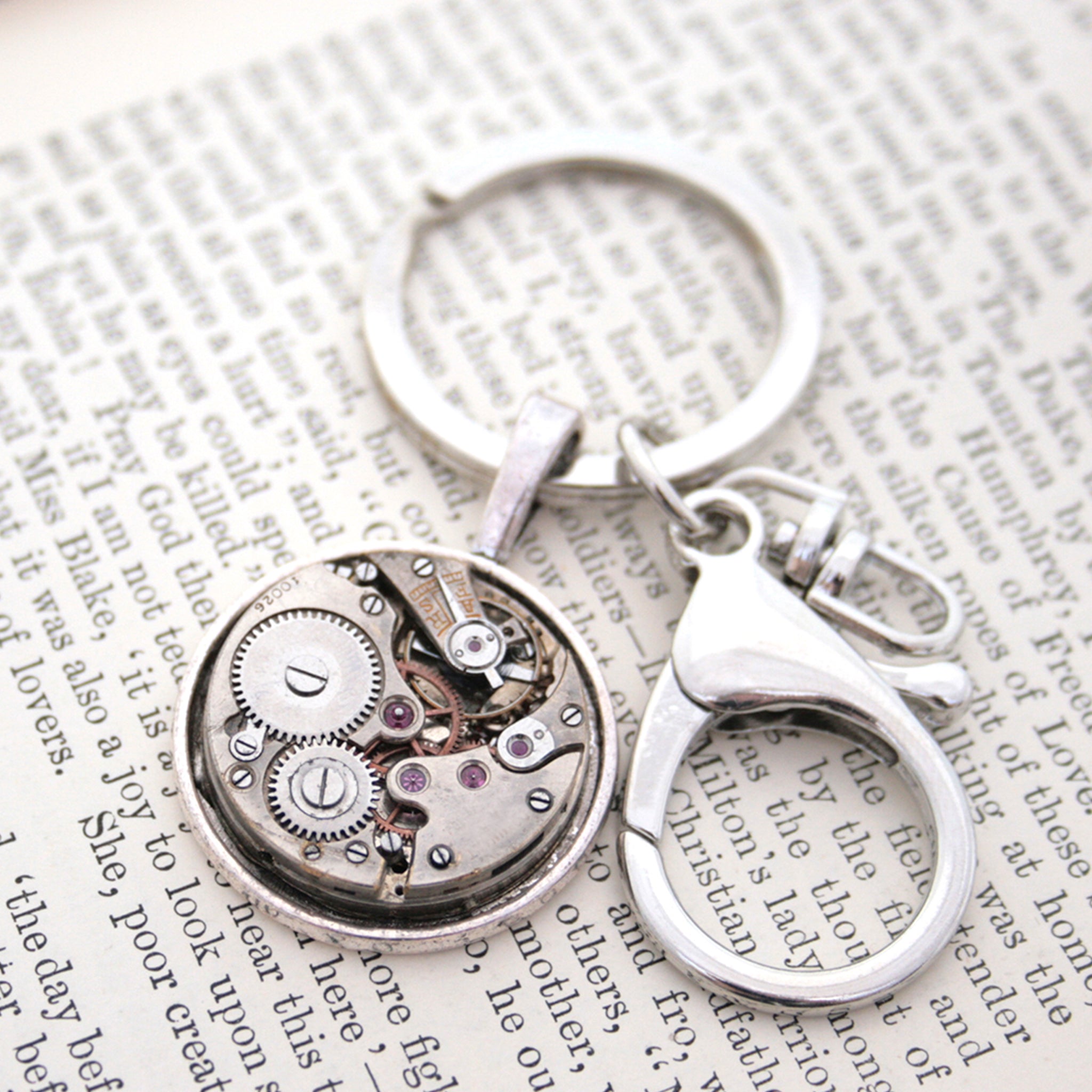 steampunk keyring for man, made of real antique watch movement on metal base in silver tone