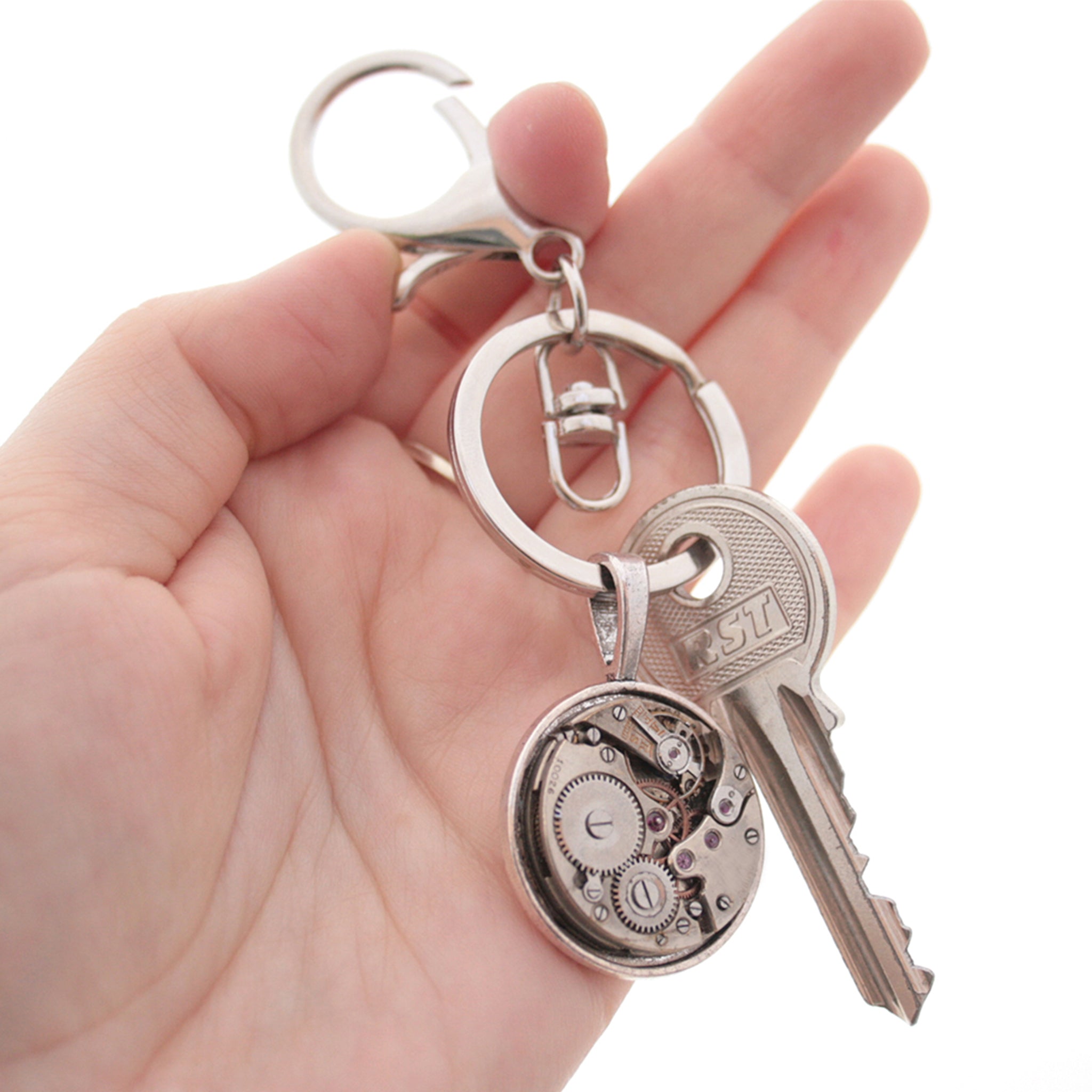 steampunk keyring for man, made of real antique watch movement on metal base in silver tone