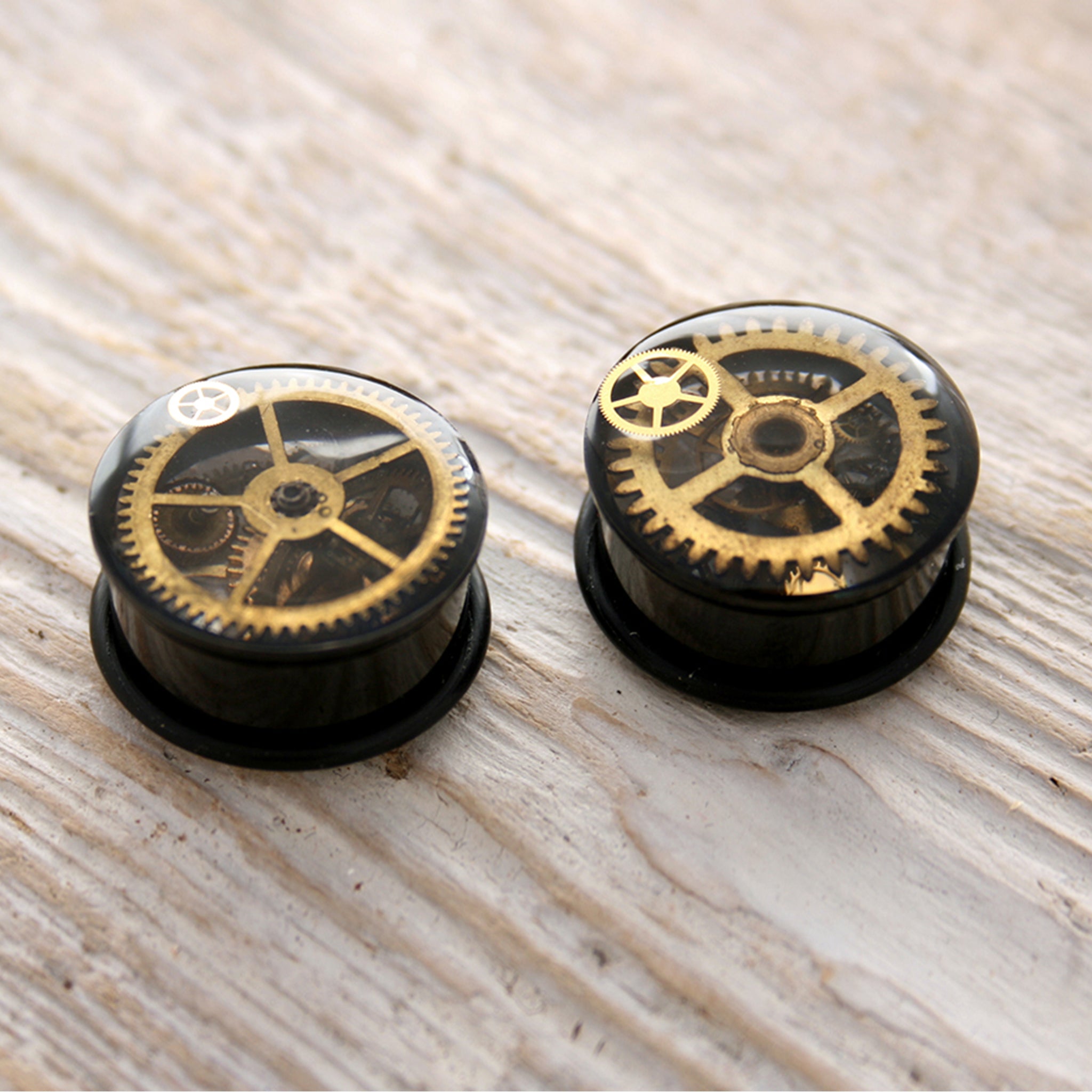 Black steampunk plug earrings with real watch parts in resin
