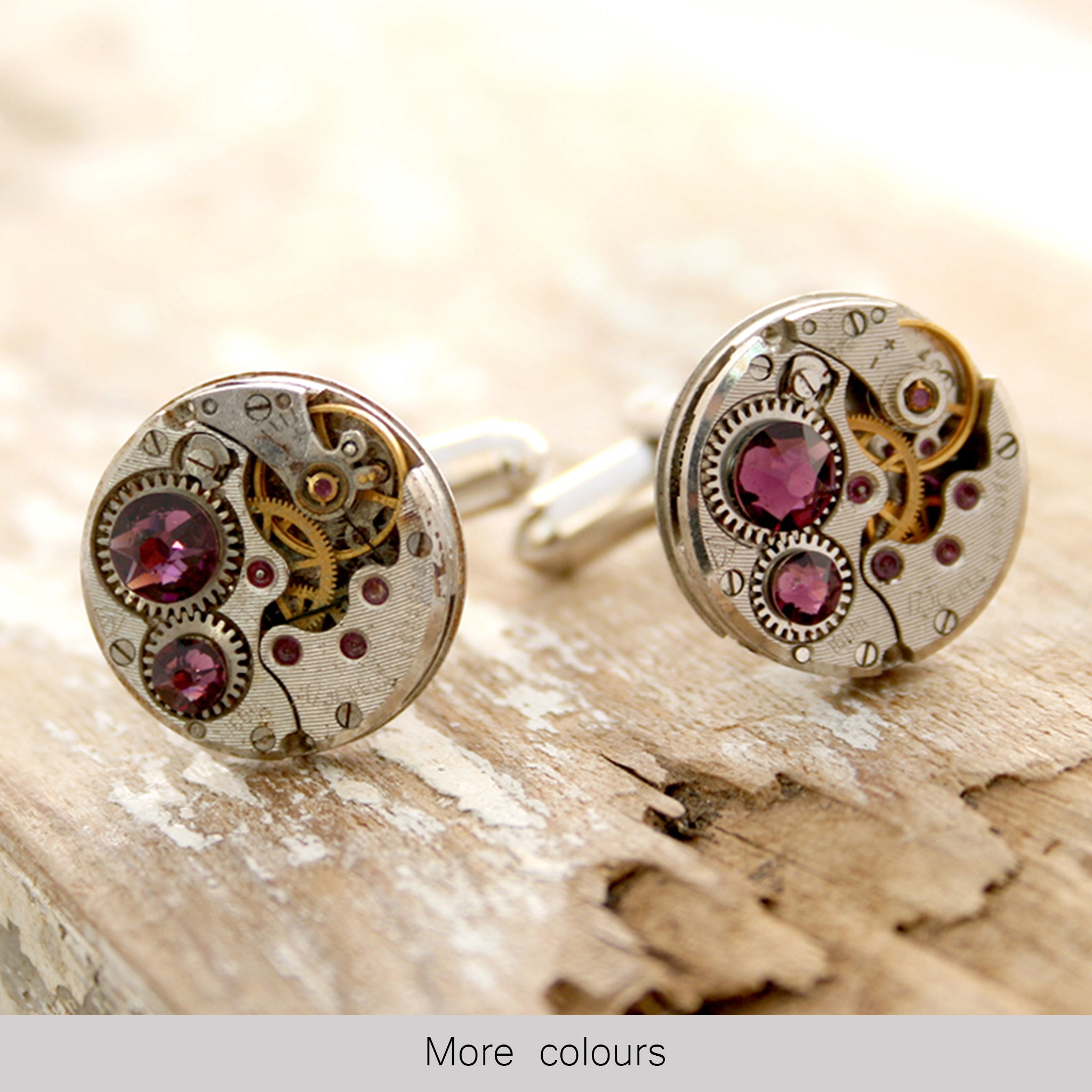  birthstone cufflinks in steampunk style featuring antique watch movements and Amethyst crystals