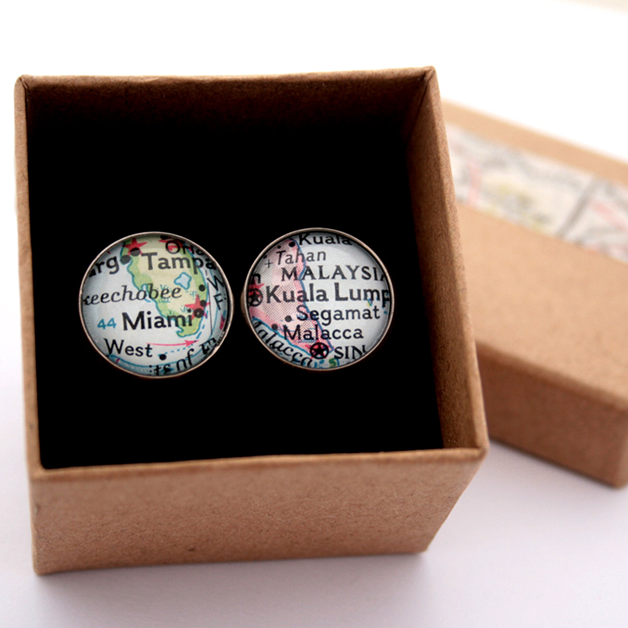 Personalised map cufflinks in silver tone featuring maps of Miami and Kuala Lumpur in a box