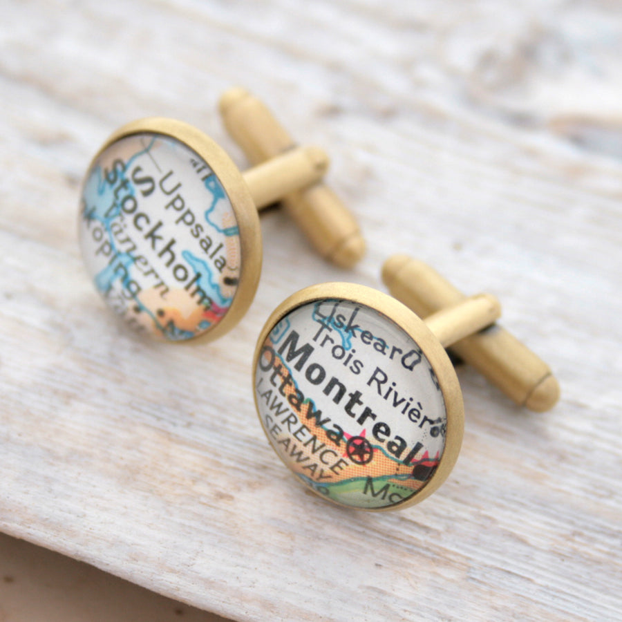 Personalised map cufflinks in brushed bronze color featuring maps of Stockholm and Montreal
