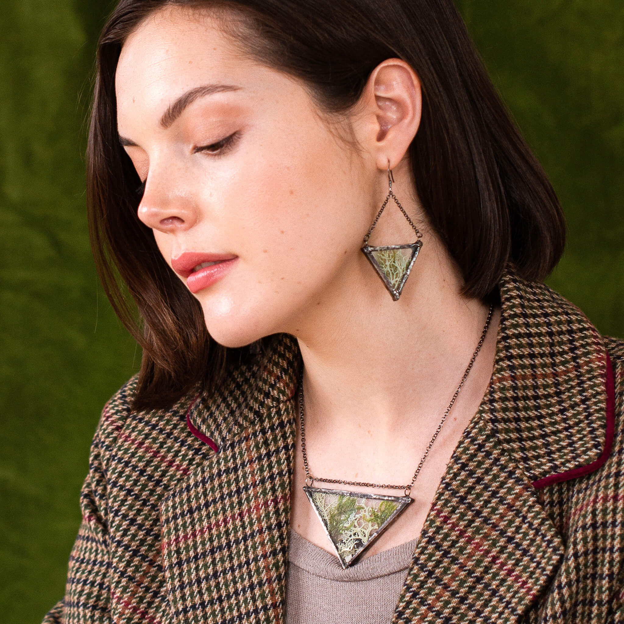 Woman wearing Triangular pressed moss earrings and necklace