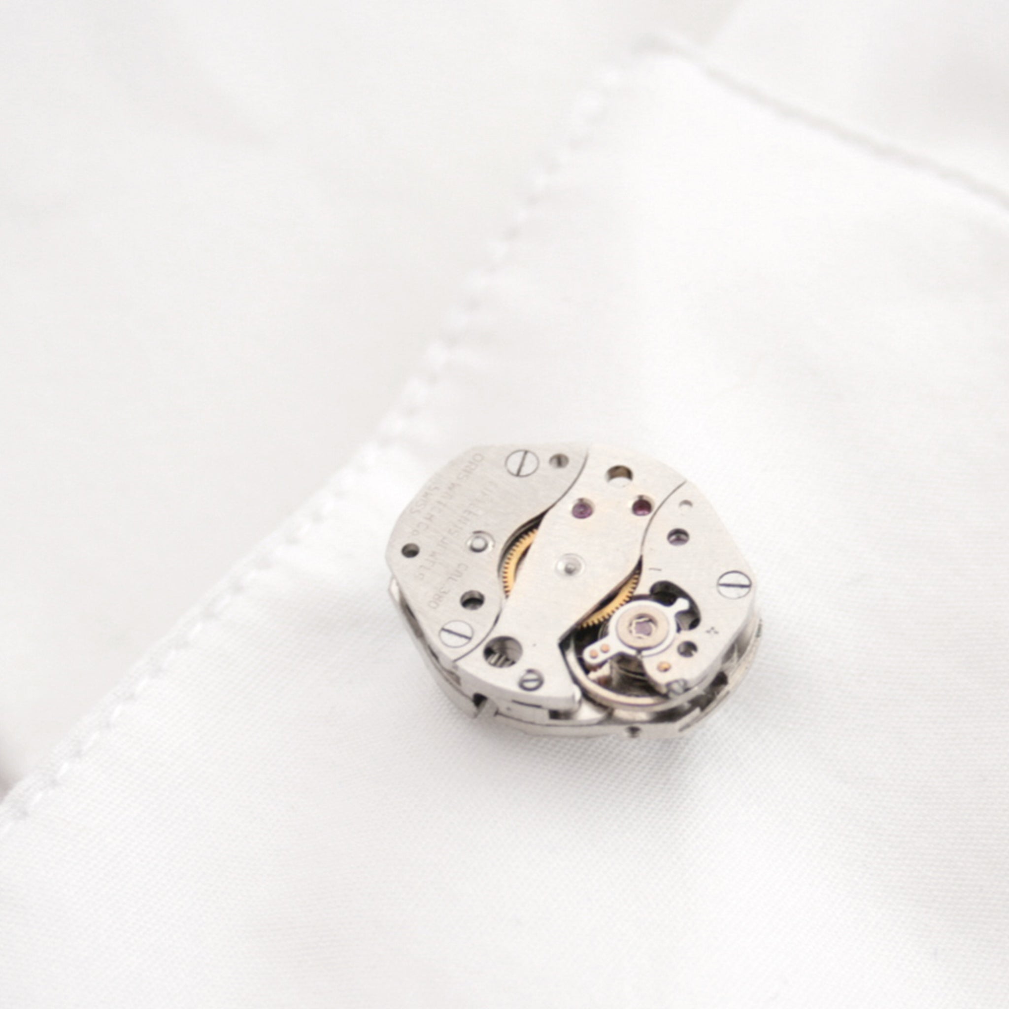cool watch cufflinks for men featuring antique movements in shirt's cuff