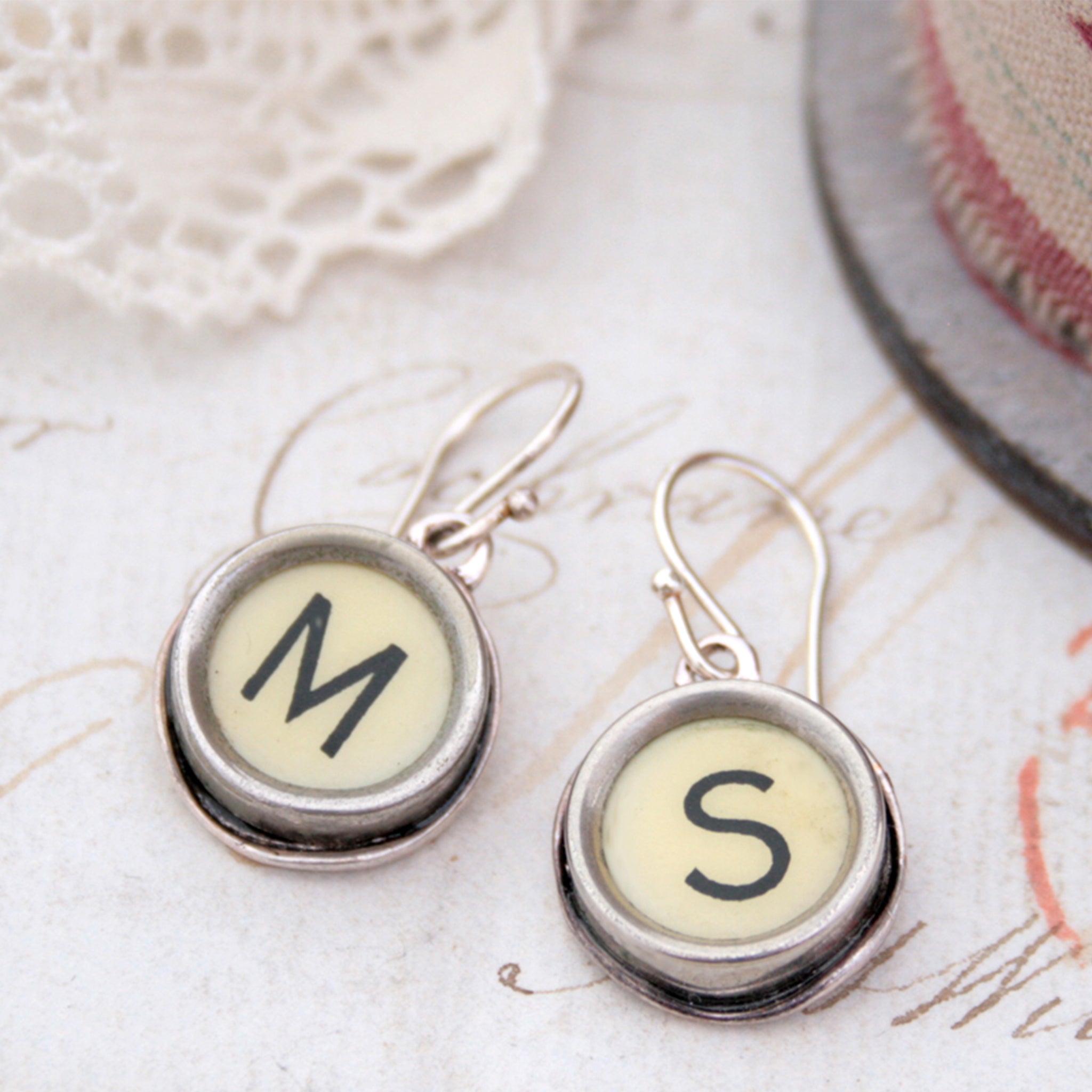 personalised initial earrings made of real typewriter keys M and S