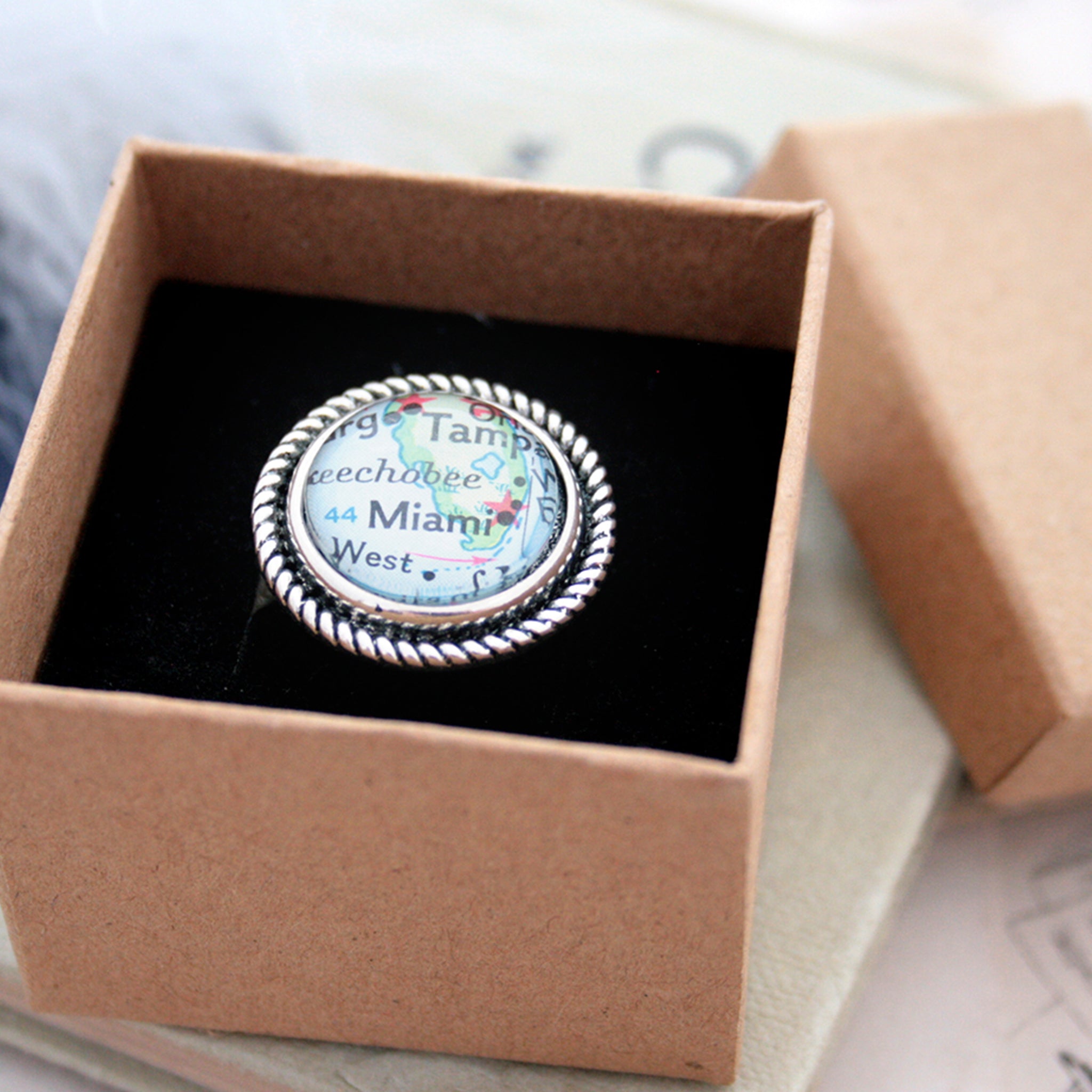 Silver tone ring with rope pattern featuring map of Miami in a box