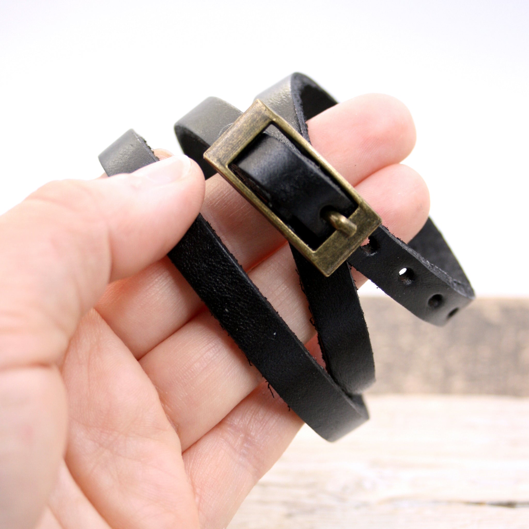 Black leather triple wrap bracelet buckle